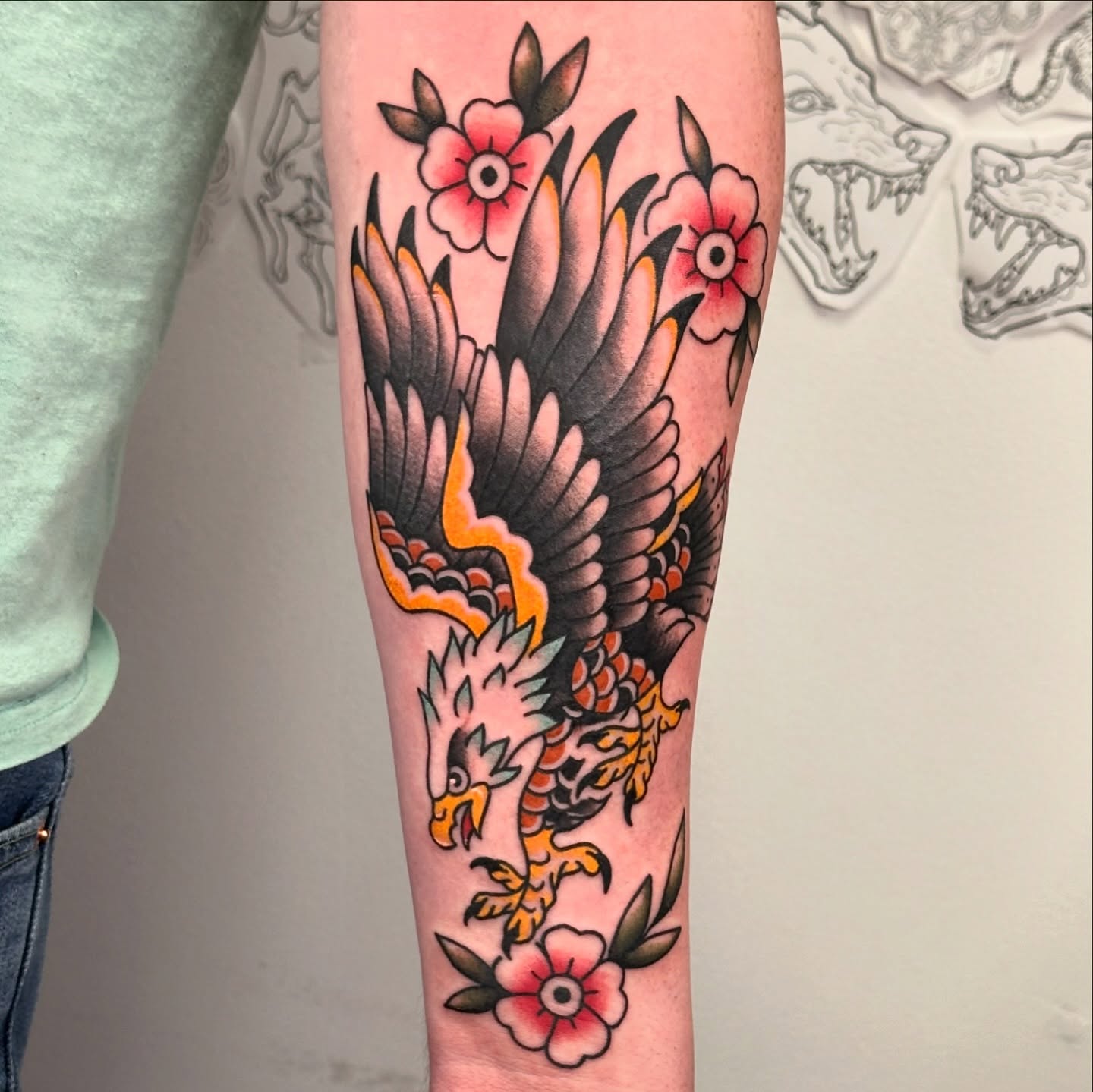 Eagle and flowers American traditional tattoo on the forearm by TATTOOLIZARD (James)