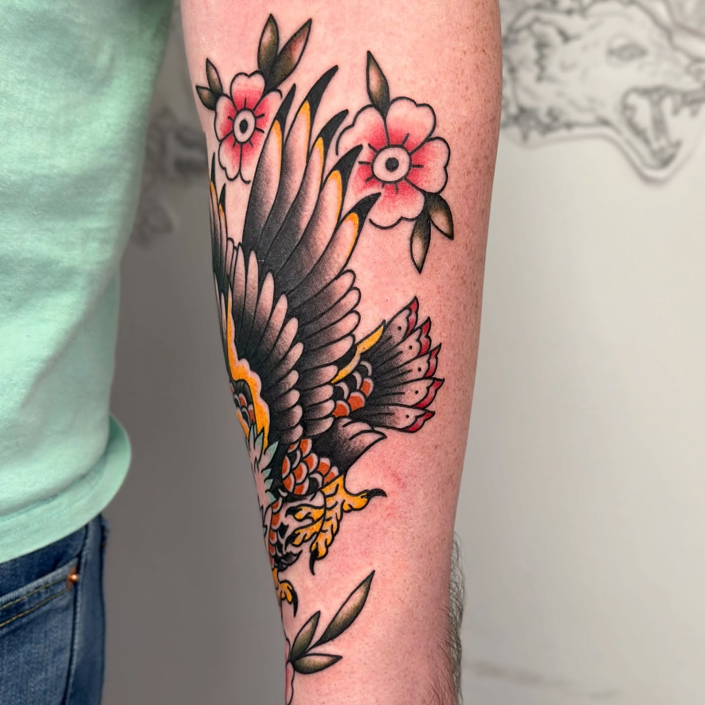 Eagle and flowers American traditional tattoo on the forearm by TATTOOLIZARD (James)