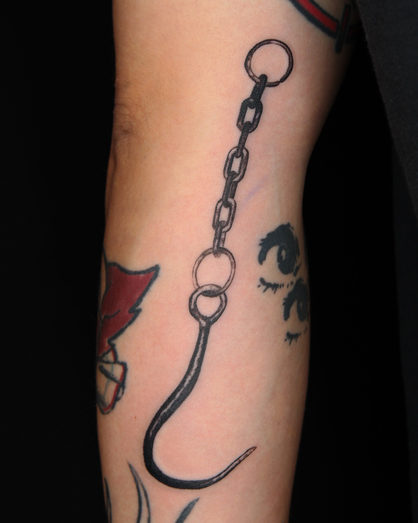 Hook and chain black and grey tattoo on the forearm by ππ²π§π§ ππ’π₯πππ« (π©π¦