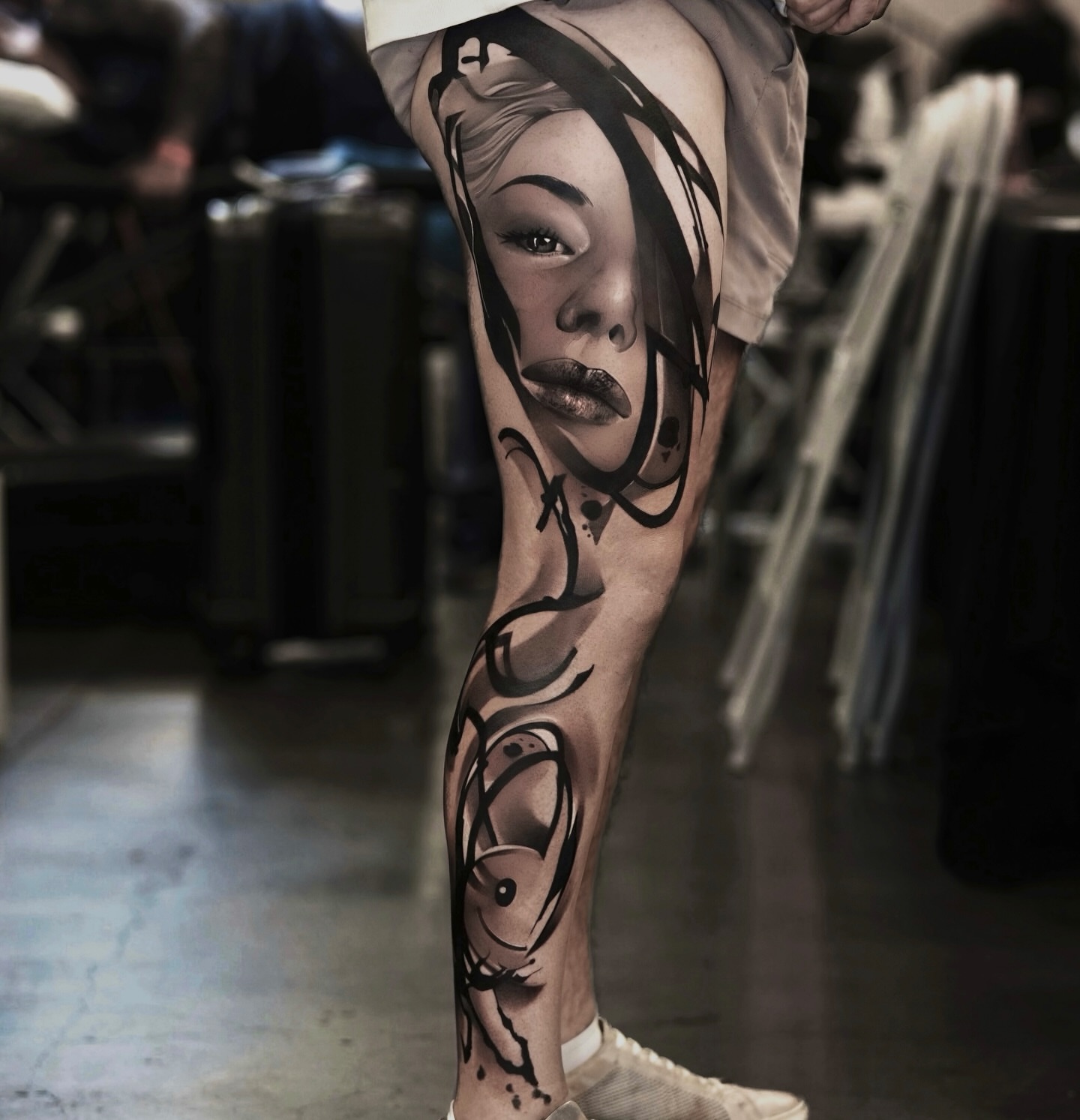 Woman's face realism tattoo on the leg by Schrail Edmund