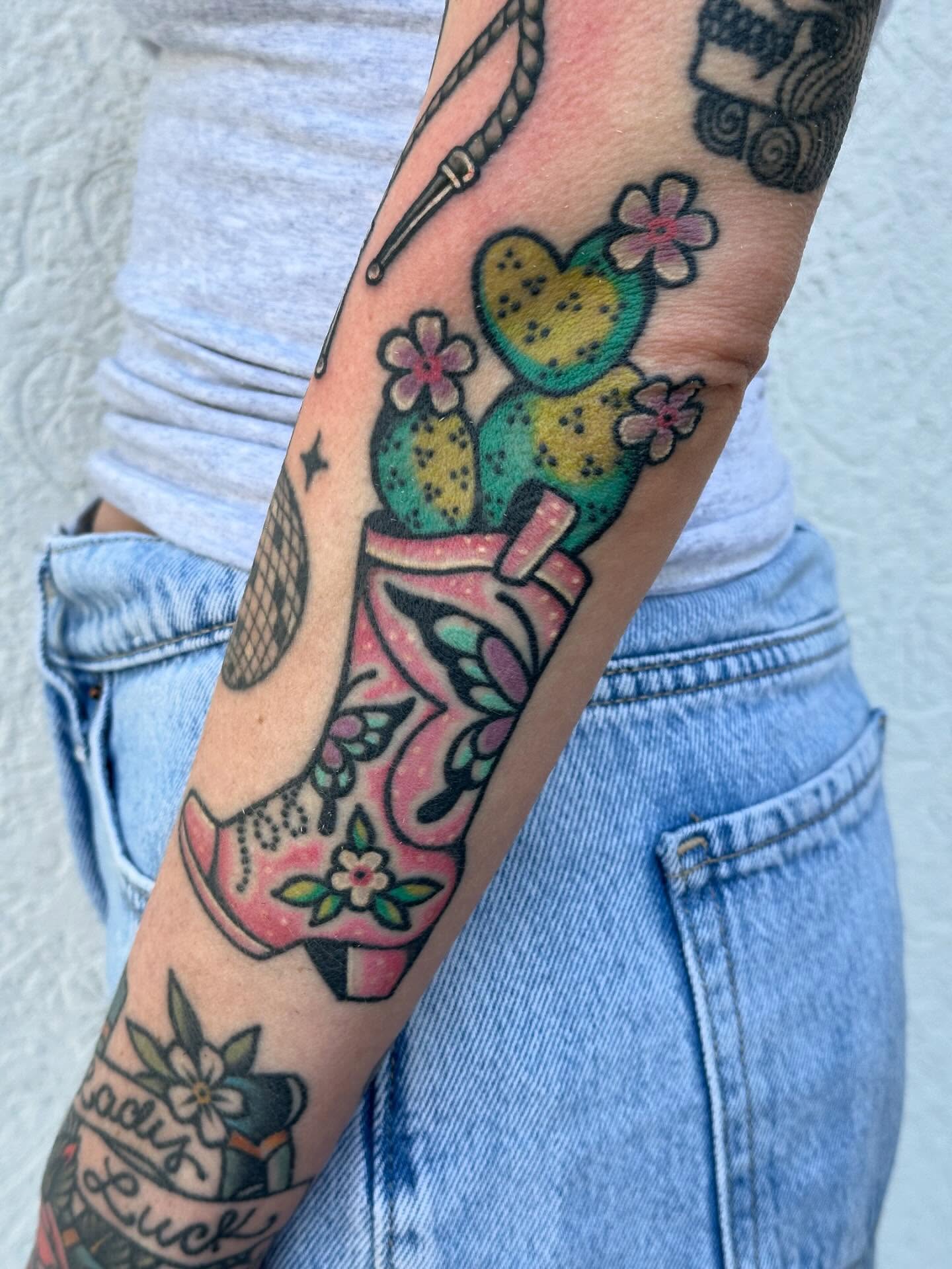 Cactus and boot new school tattoo on the forearm by Ginny Marie Kalnasy
