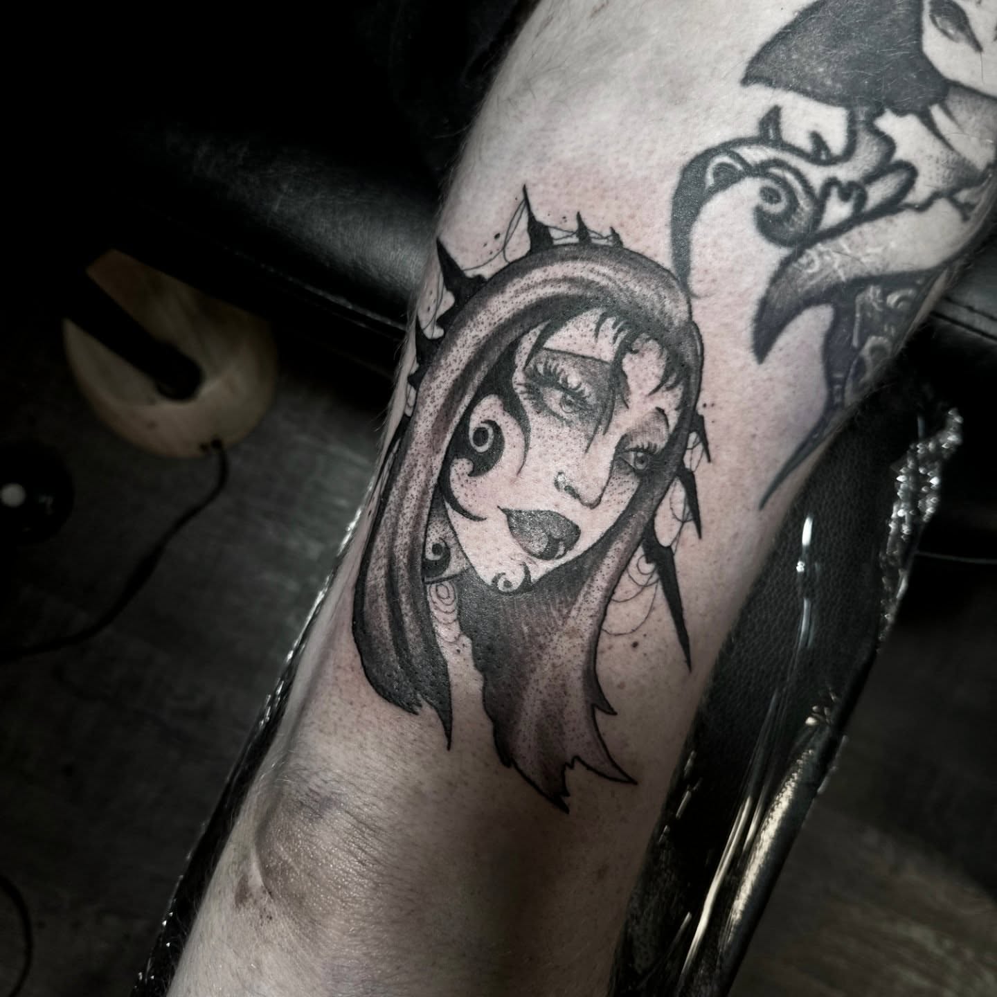 Woman with dramatic makeup dotwork tattoo on the forearm by Ema Fish