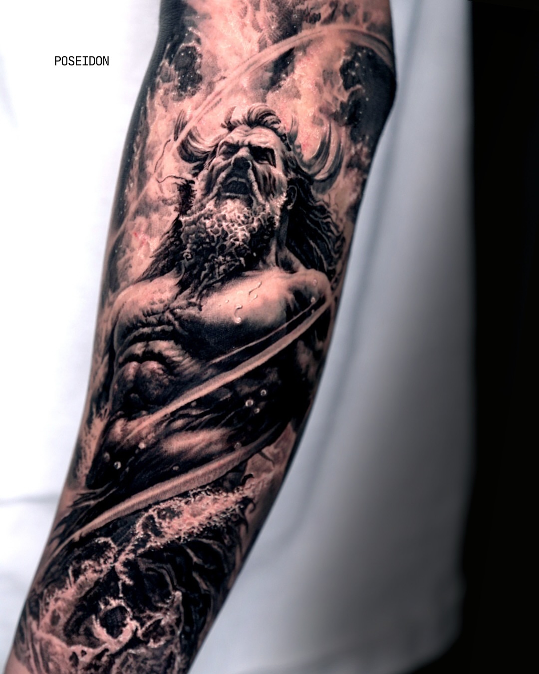 Poseidon realism tattoo on the forearm by Black and Grey Tattoo Artist Umzii