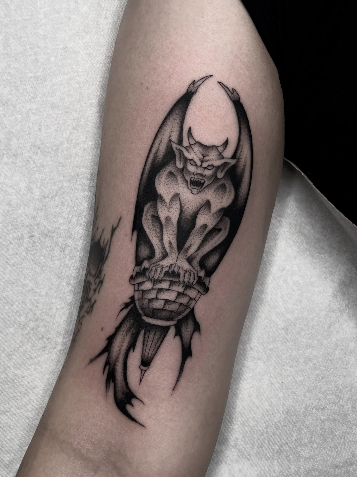 Demon black and grey tattoo on the forearm by Dakota Jenner