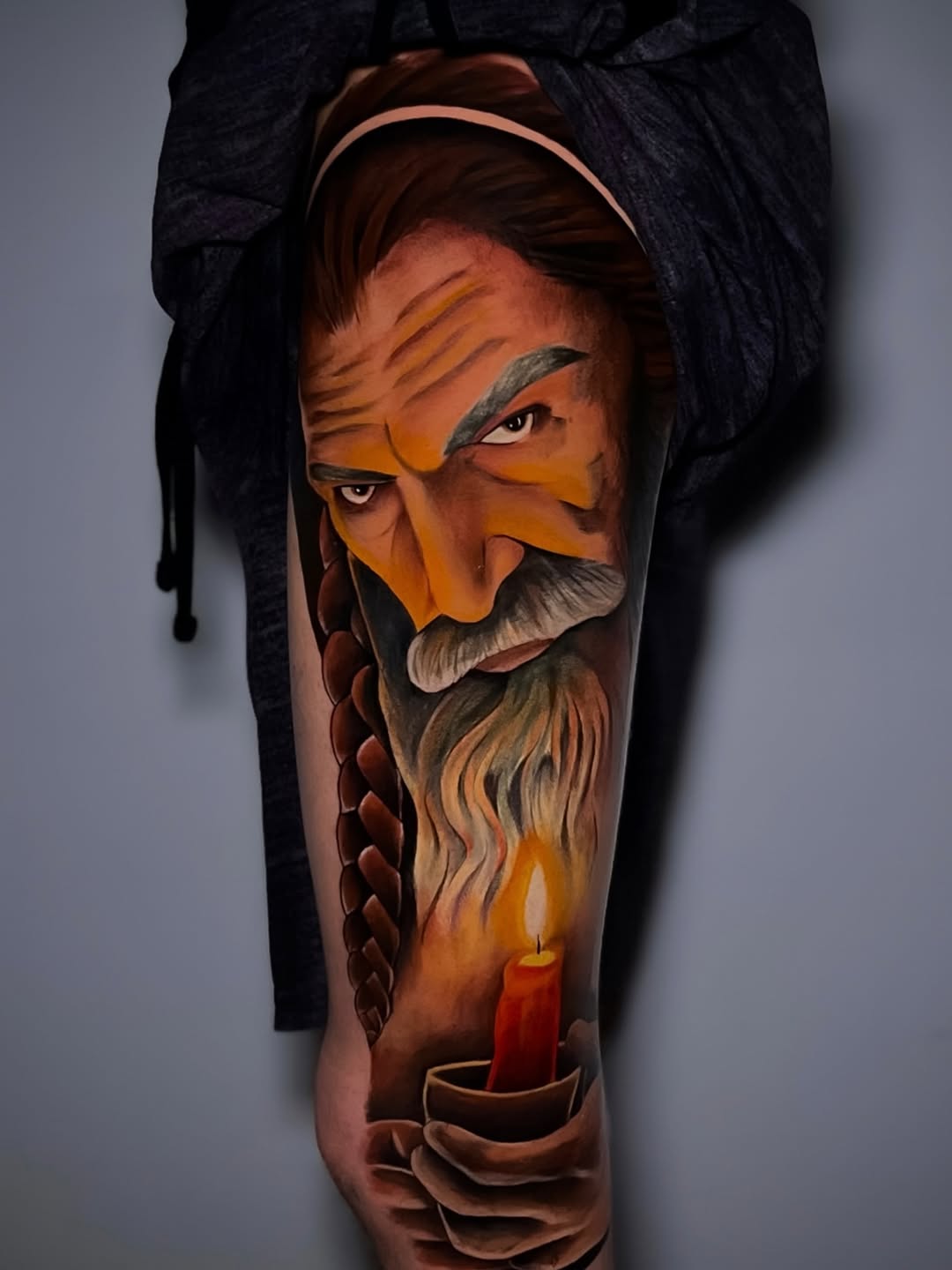 Old man holding a candle neo-traditional tattoo on the forearm by ⚜️Lalo Godina Tattoo⚜️