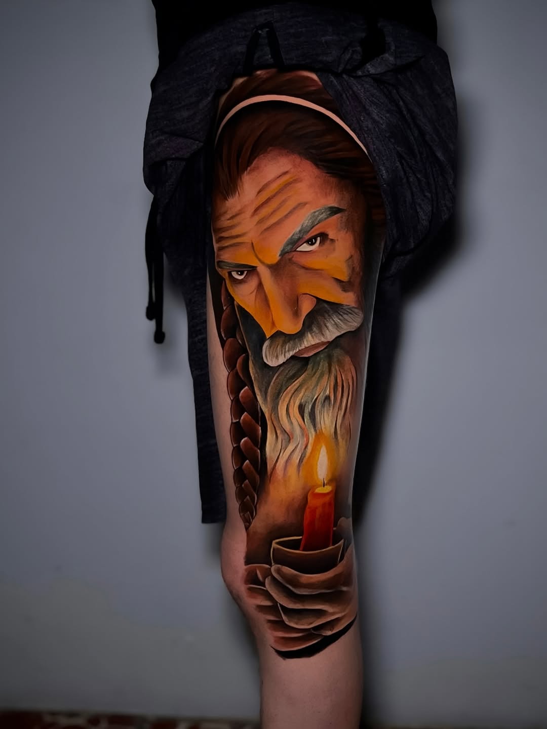 Old man holding a candle neo-traditional tattoo on the forearm by ⚜️Lalo Godina Tattoo⚜️