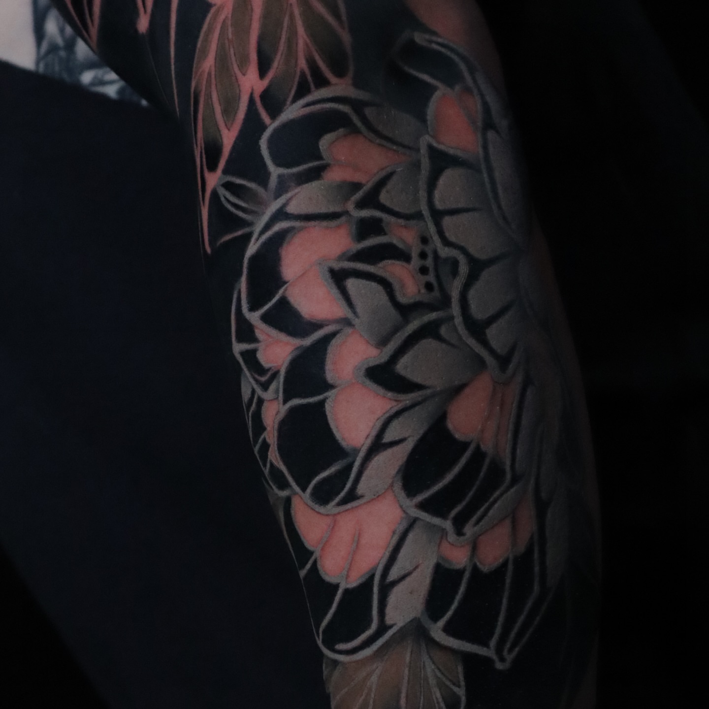Pinecone geometric tattoo on the forearm by Joshua Weeks