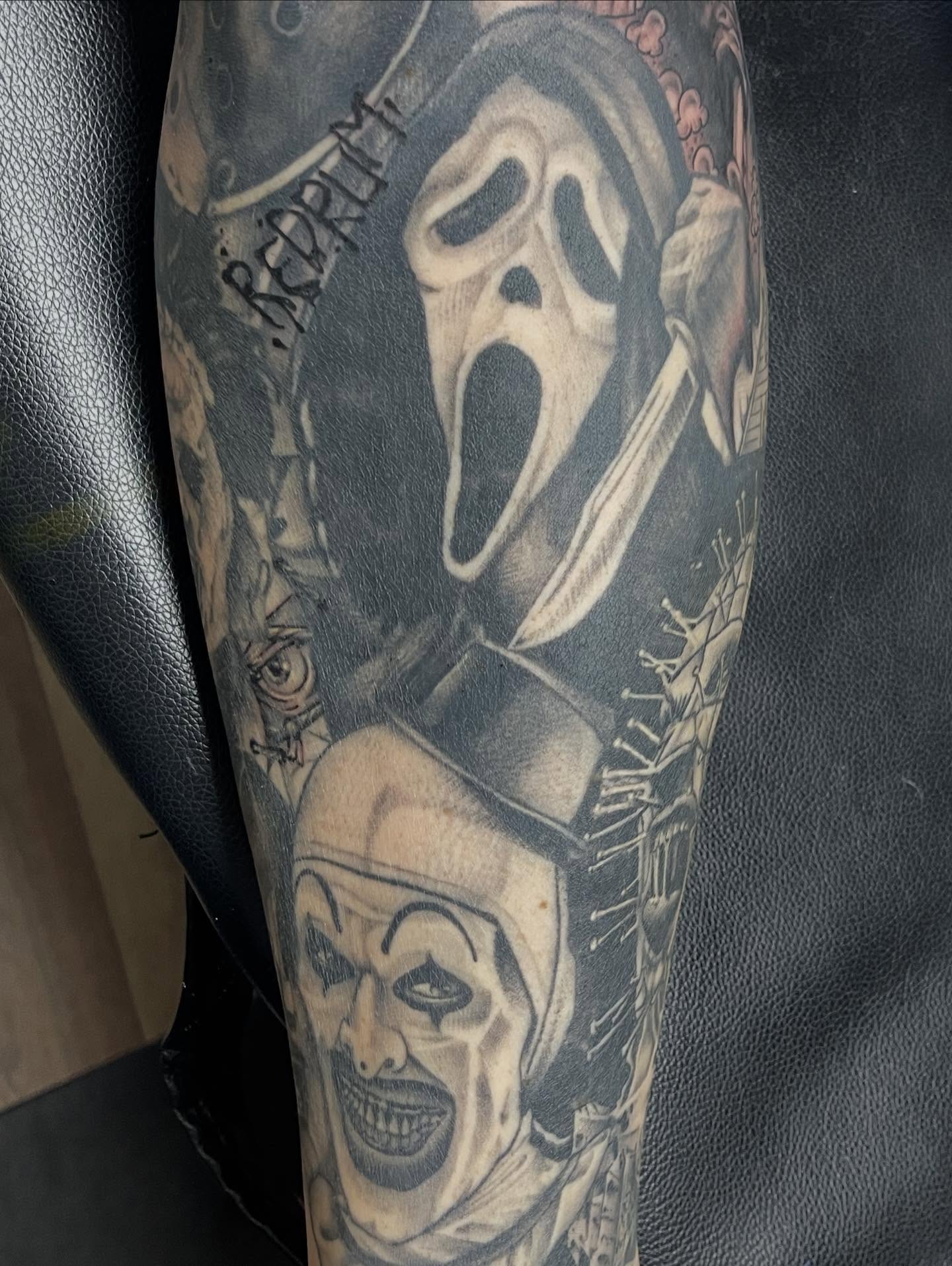 Scream mask and clown realism tattoo on the forearm by Tina Gregg, North Ridgeville, Ohio