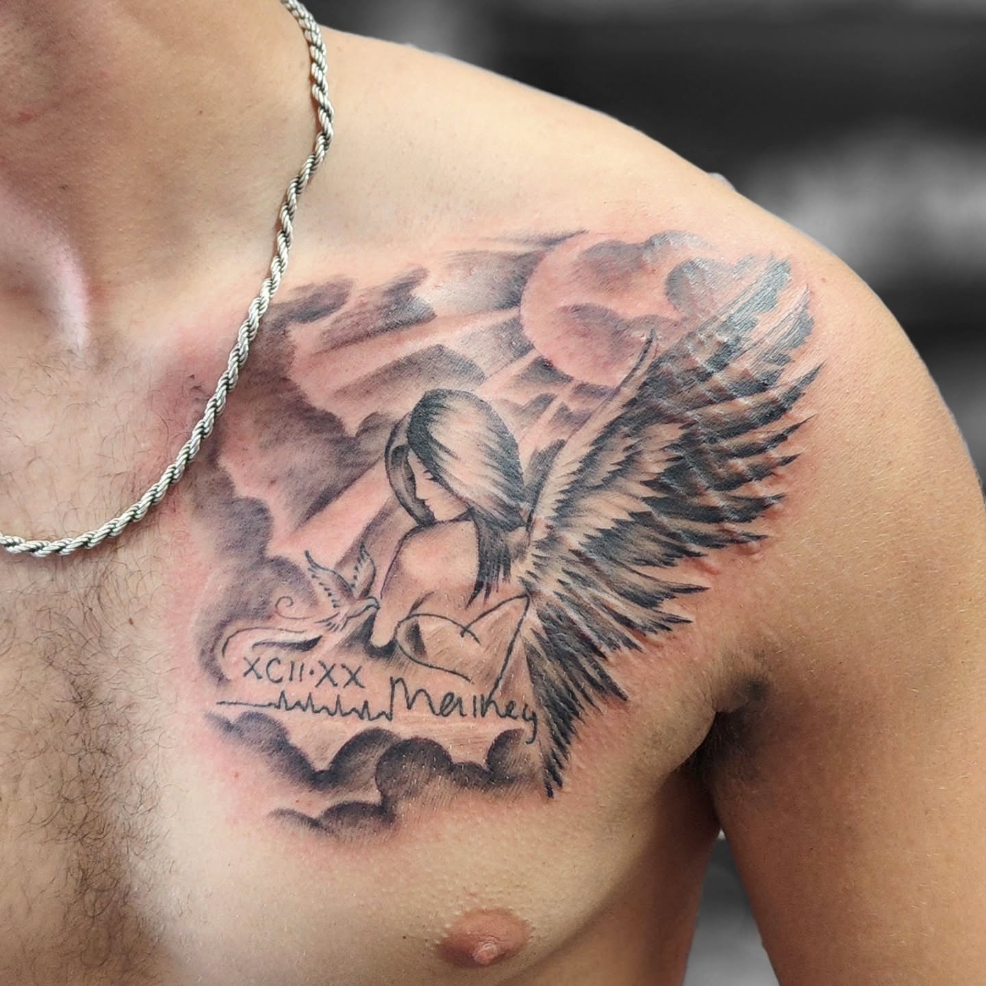 Angel with dove realism tattoo on the chest by Dennis Foust