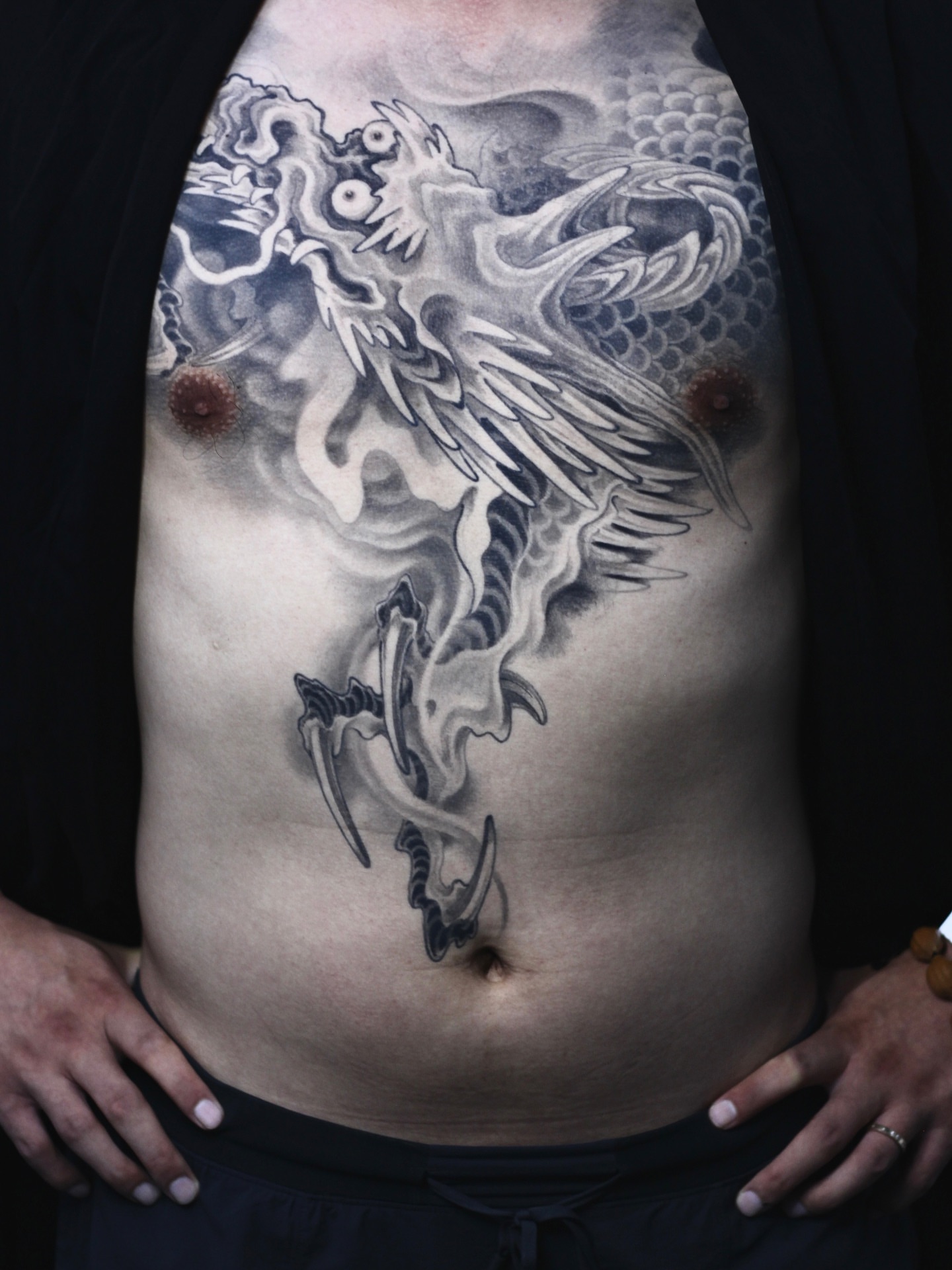 Dragon black and grey tattoo on the torso by 睿刺造物