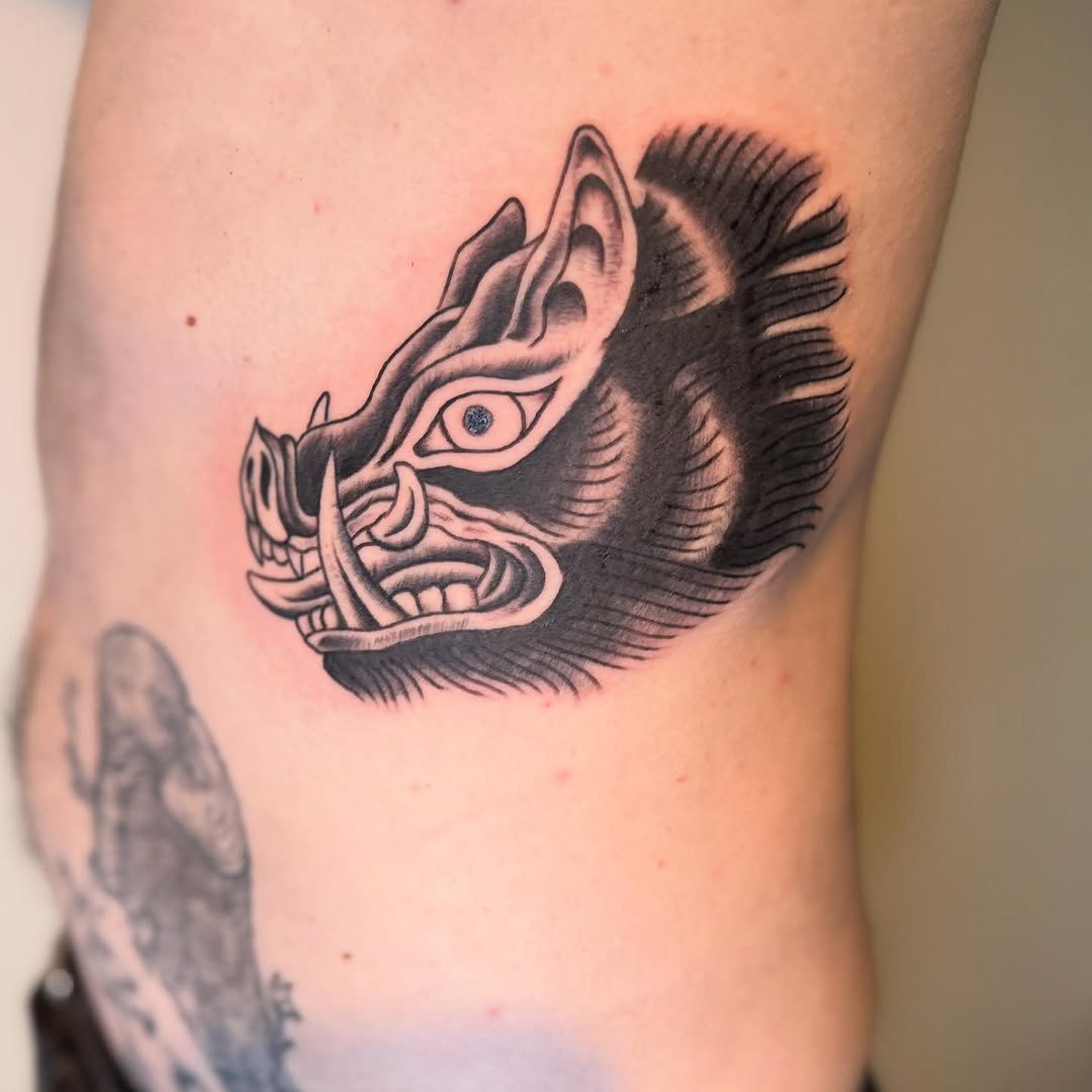 Boar head realism tattoo on the forearm by Elmer Lethco