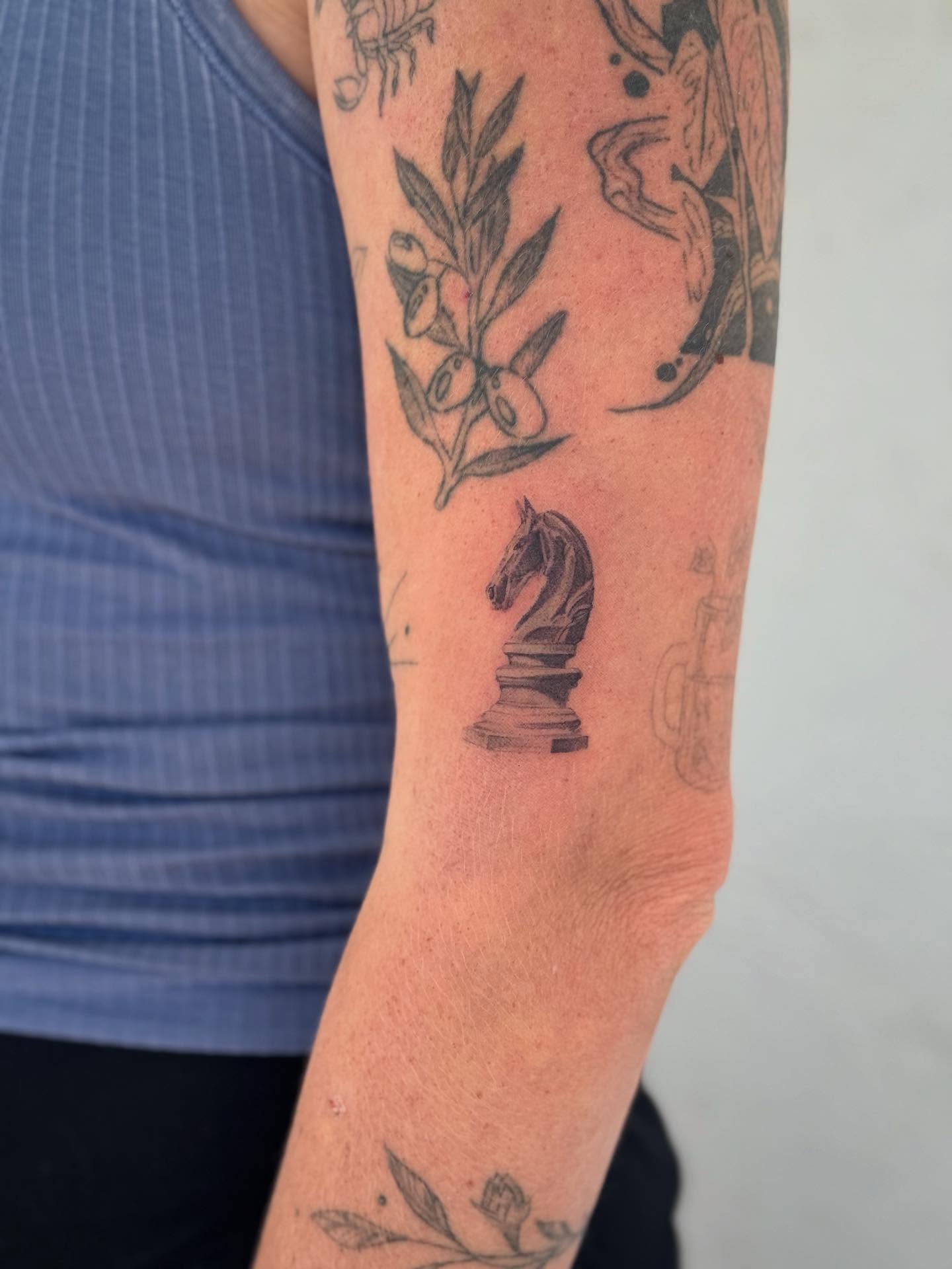 Chess knight black and grey tattoo on the forearm by Karina ⋆⭒˚.⋆