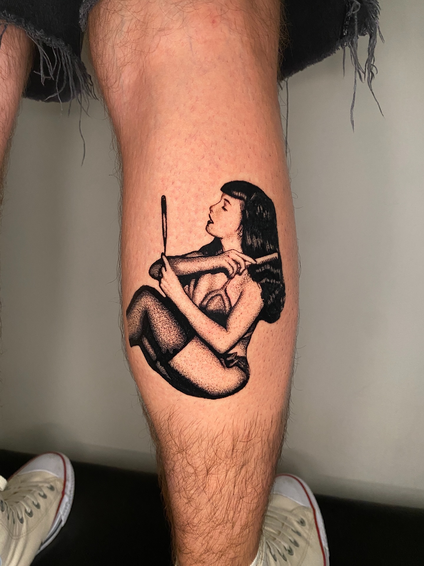 Woman with flute dotwork tattoo on the leg by Aidan Leery, Portland, Oregon