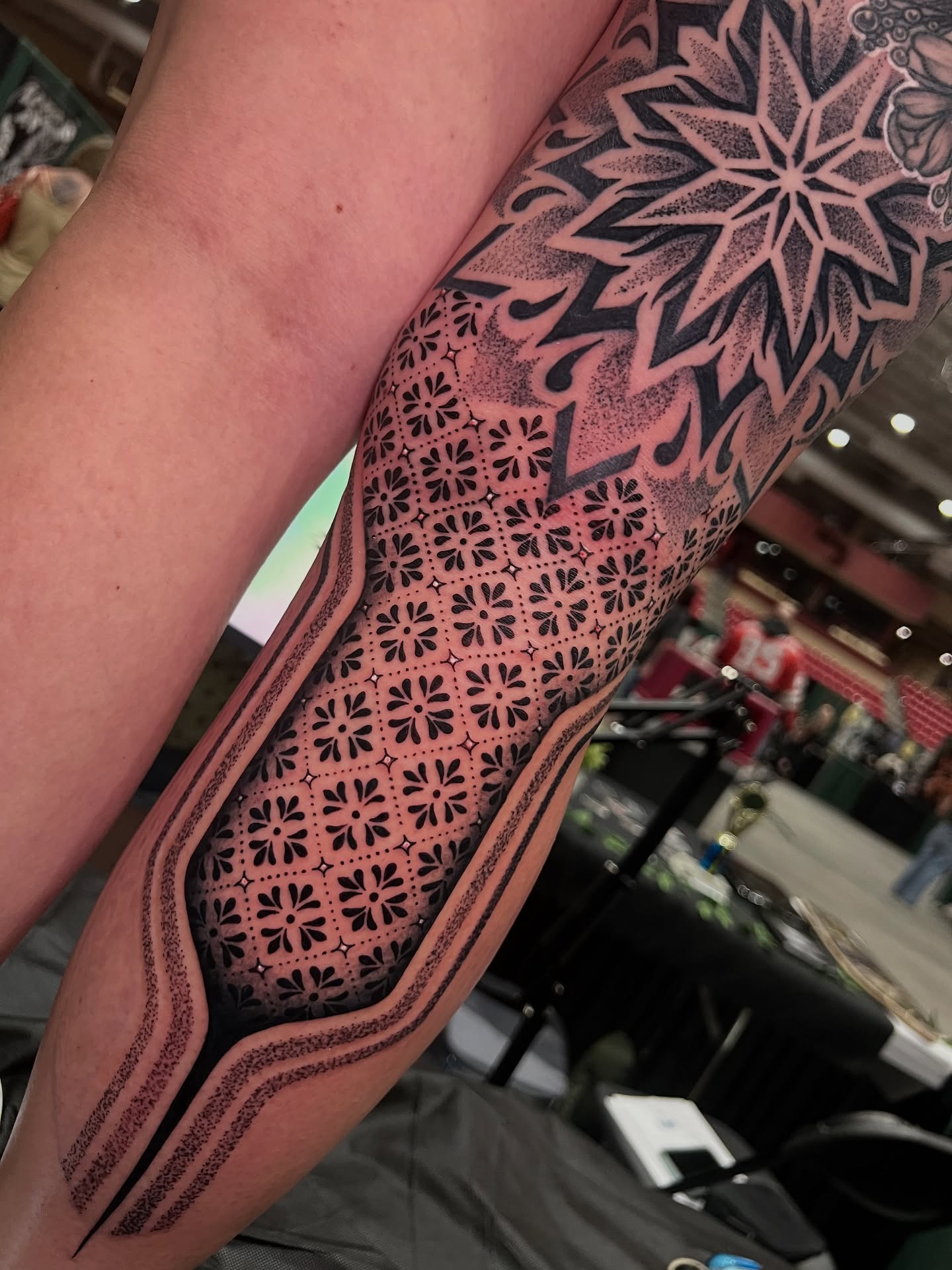 Geometric pattern dotwork tattoo on the forearm by Tattoo Artist
