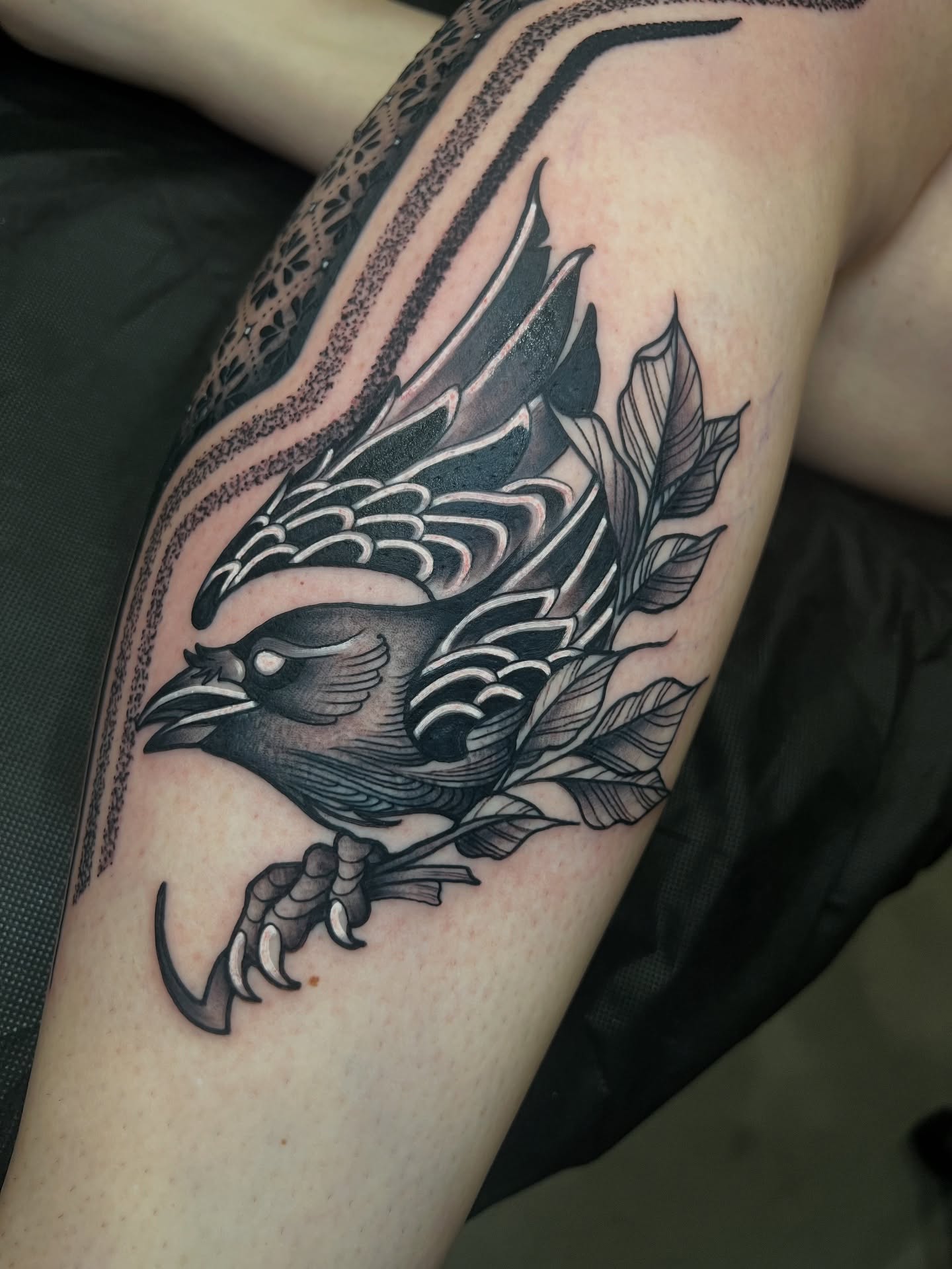 Bird black and grey tattoo on the forearm by Tattoo Artist