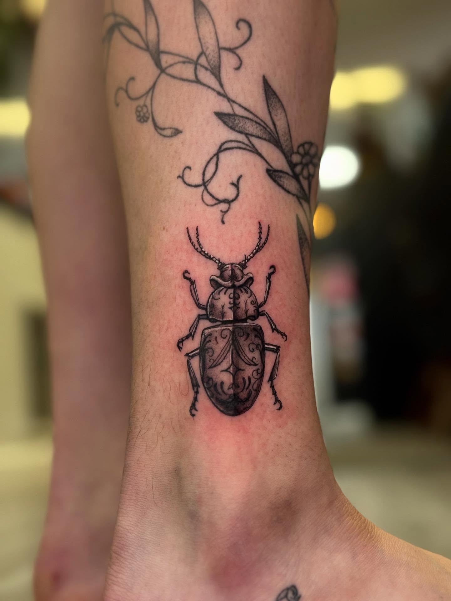 Beetle black and grey tattoo on the calf by Khang🇻🇳