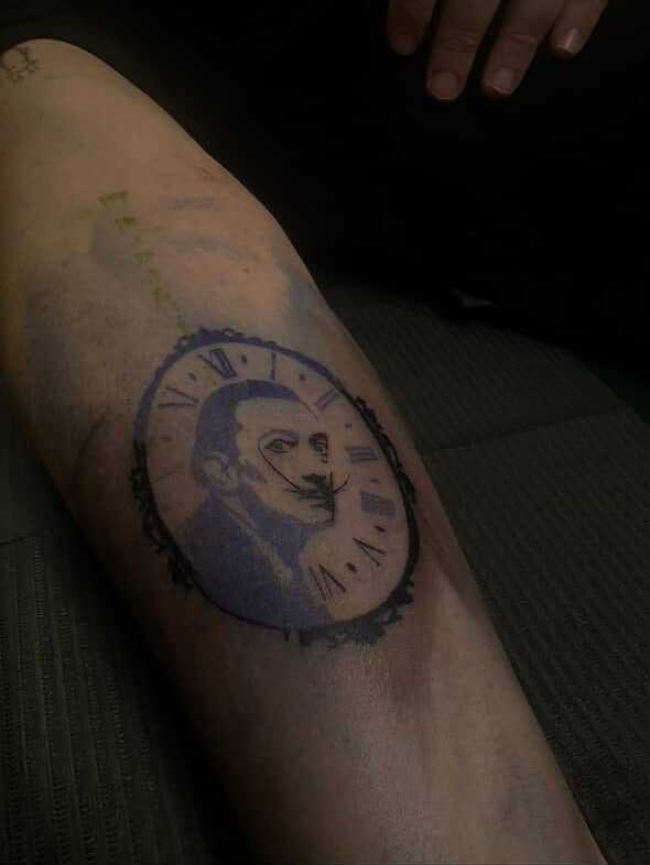Clock with portrait realism tattoo on the forearm by Trinity