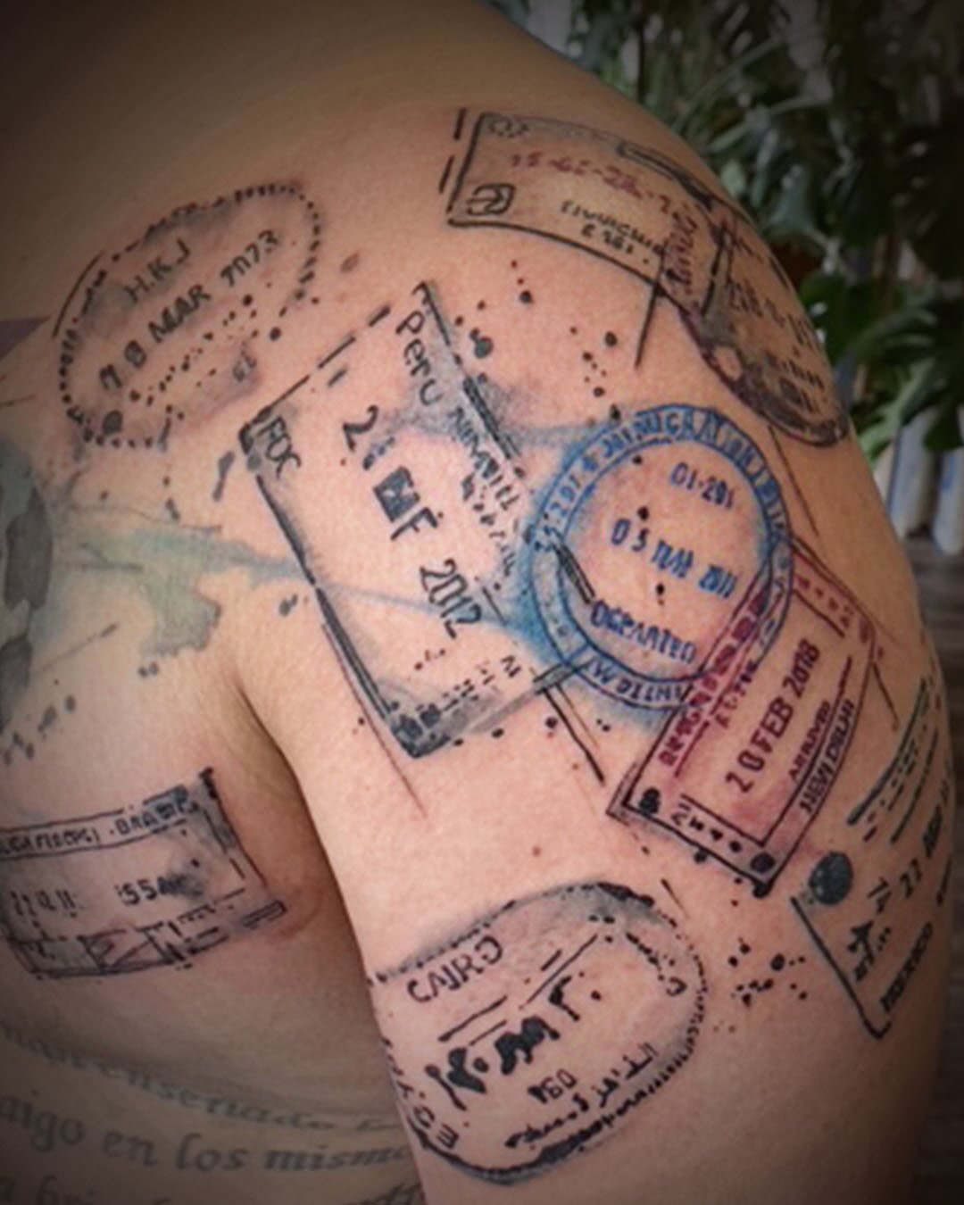 Passport stamps dotwork tattoo on the shoulder by Gene Coffey, New York, New York