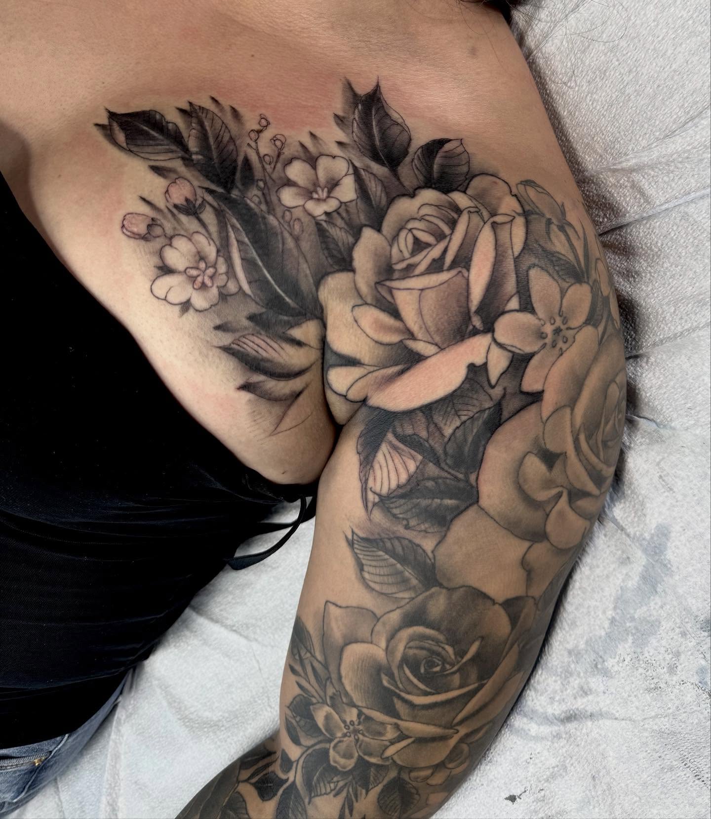 Floral bouquet realism tattoo on the upper arm by jonhighland