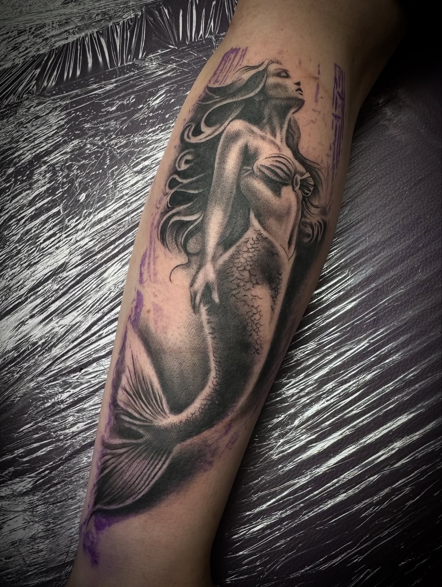 Mermaid black and grey tattoo on the forearm by Tattoo Artist - the Goat