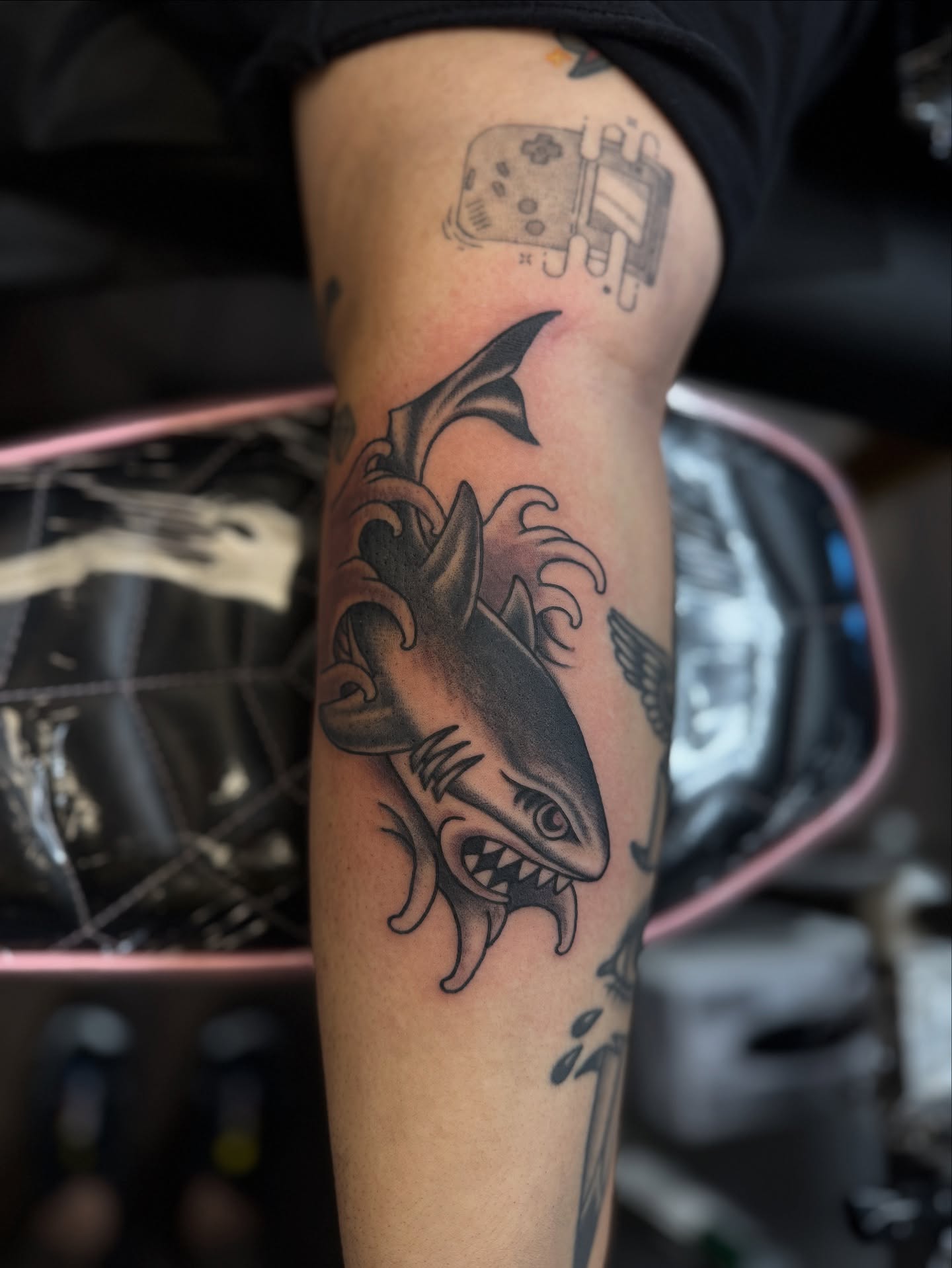 Shark black and grey tattoo on the forearm by Sarah Pham