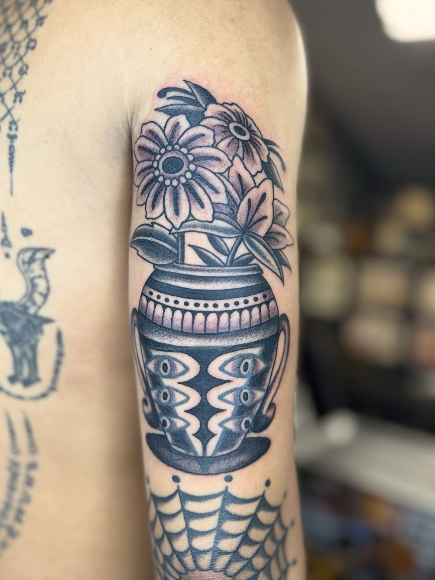 Flower pot with flowers American traditional tattoo on the forearm by Sarah Pham