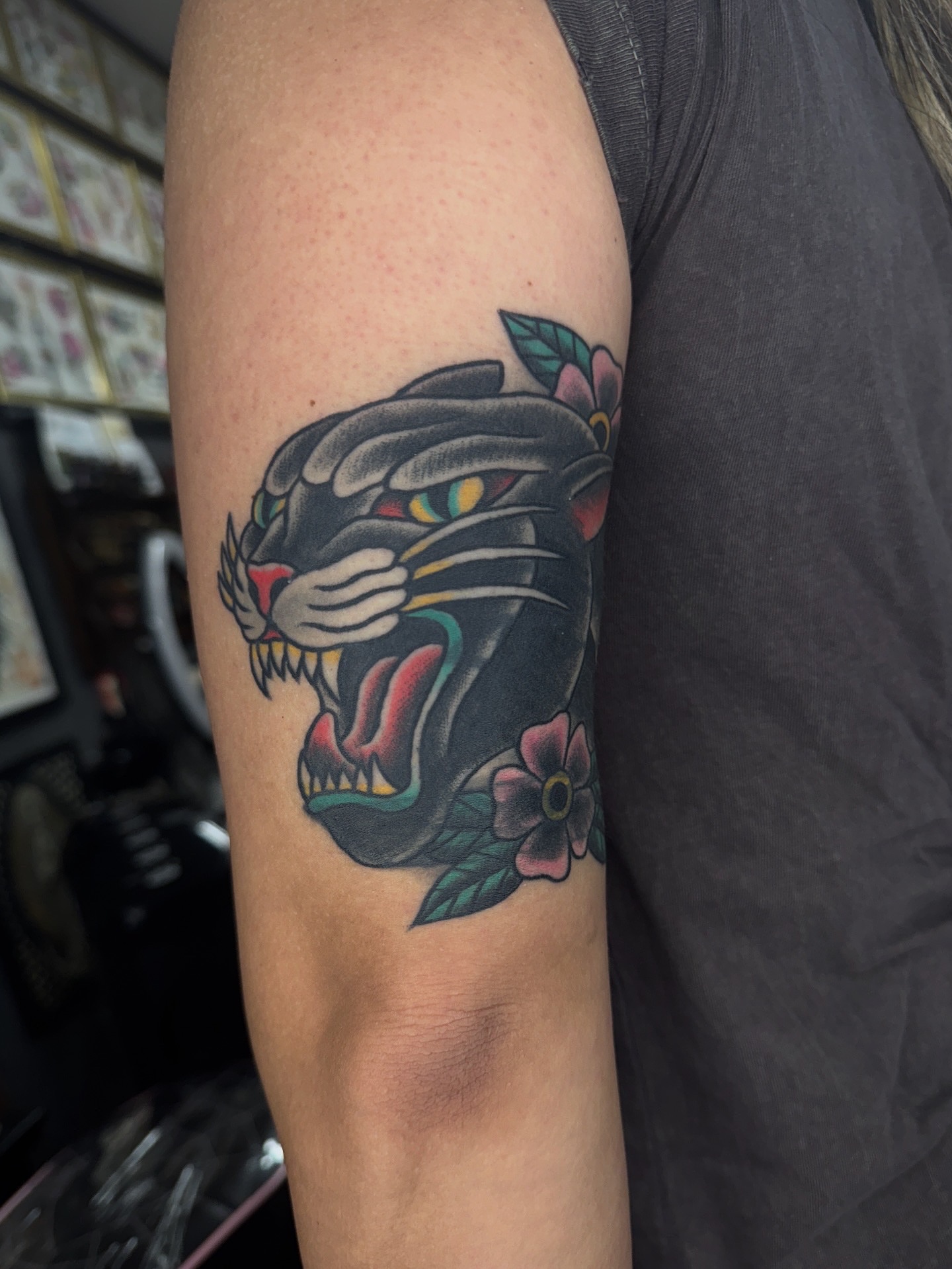 Panther head American traditional tattoo on the forearm by Sarah Pham
