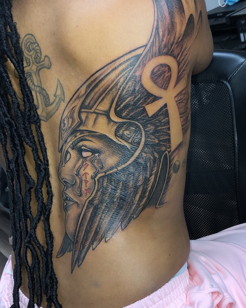 Ancient warrior realism tattoo on the ribs by Ray Wiggins