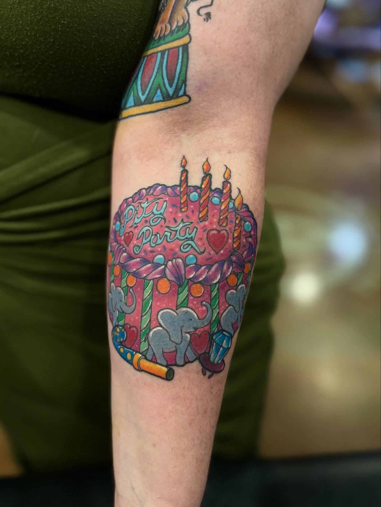 Birthday cake new school tattoo on the forearm by David C. McGhee