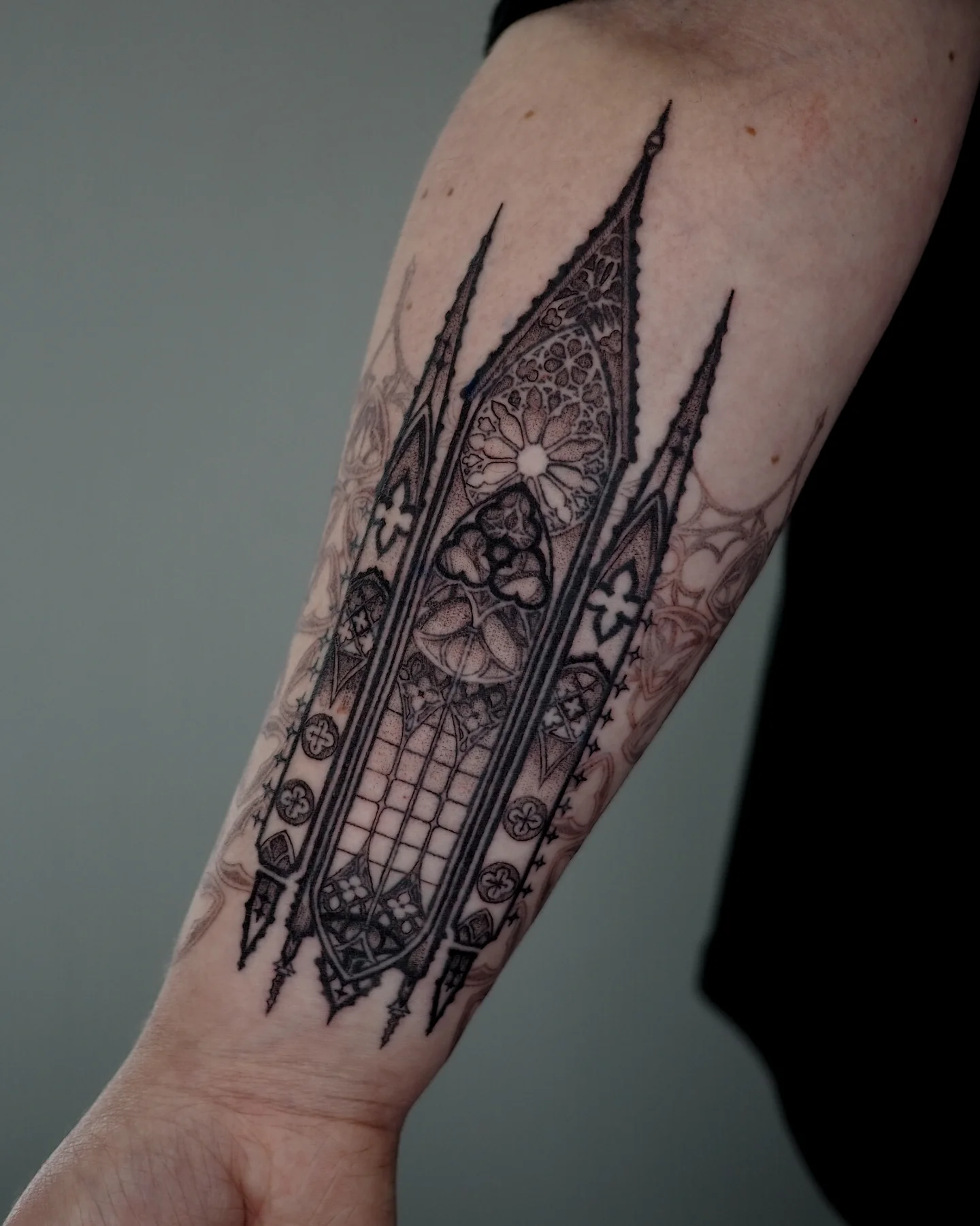 Gothic cathedral geometric tattoo on the forearm by MK