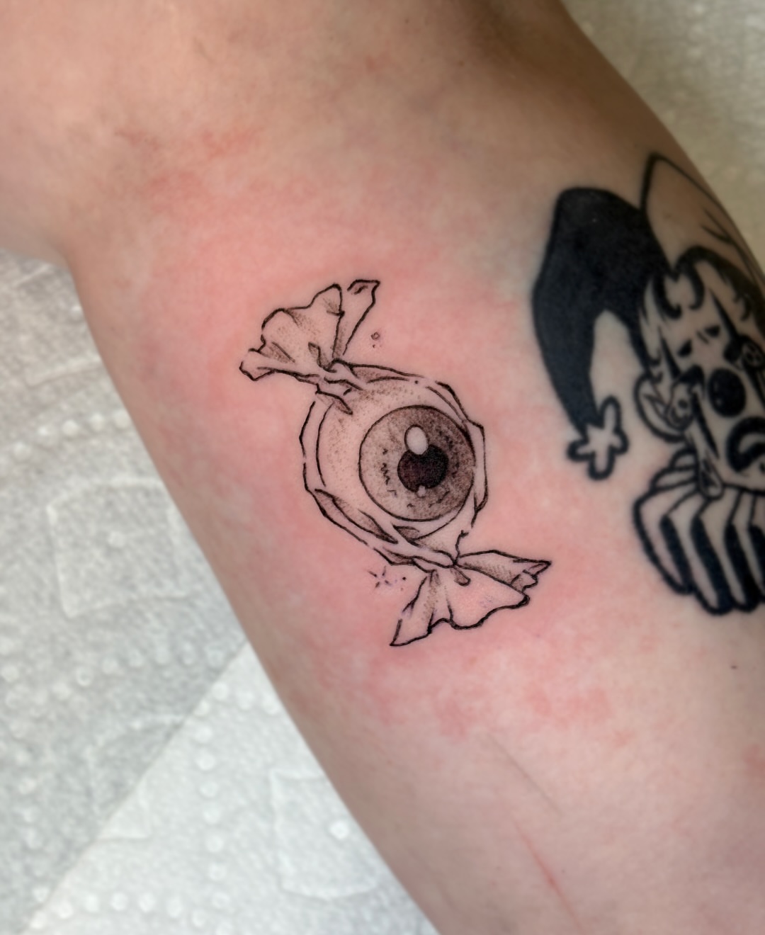 Eye with bow dotwork tattoo on the forearm by jo, Wichita, Kansas