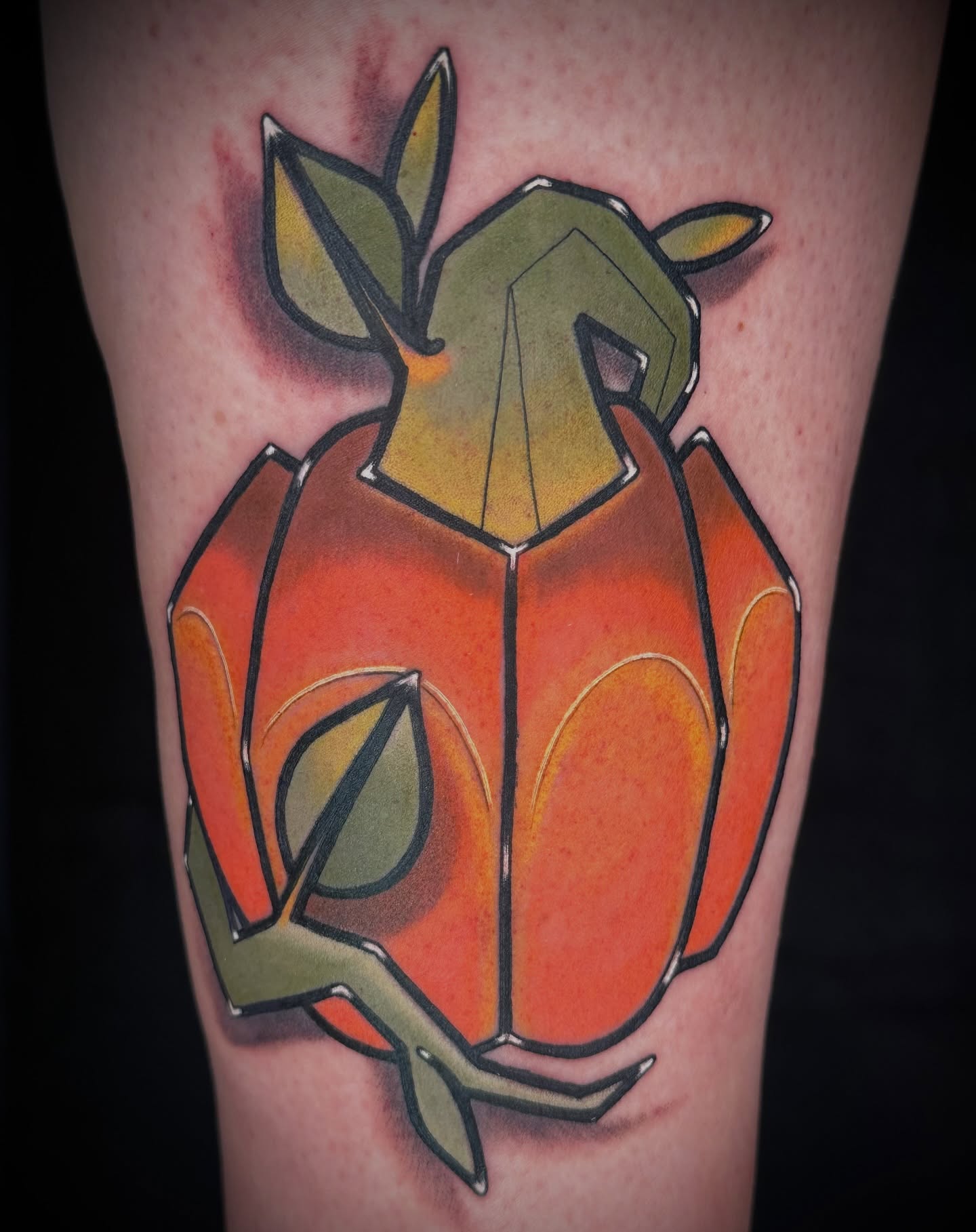 Geometric apple geometric tattoo on the forearm by B.G. Germershausen