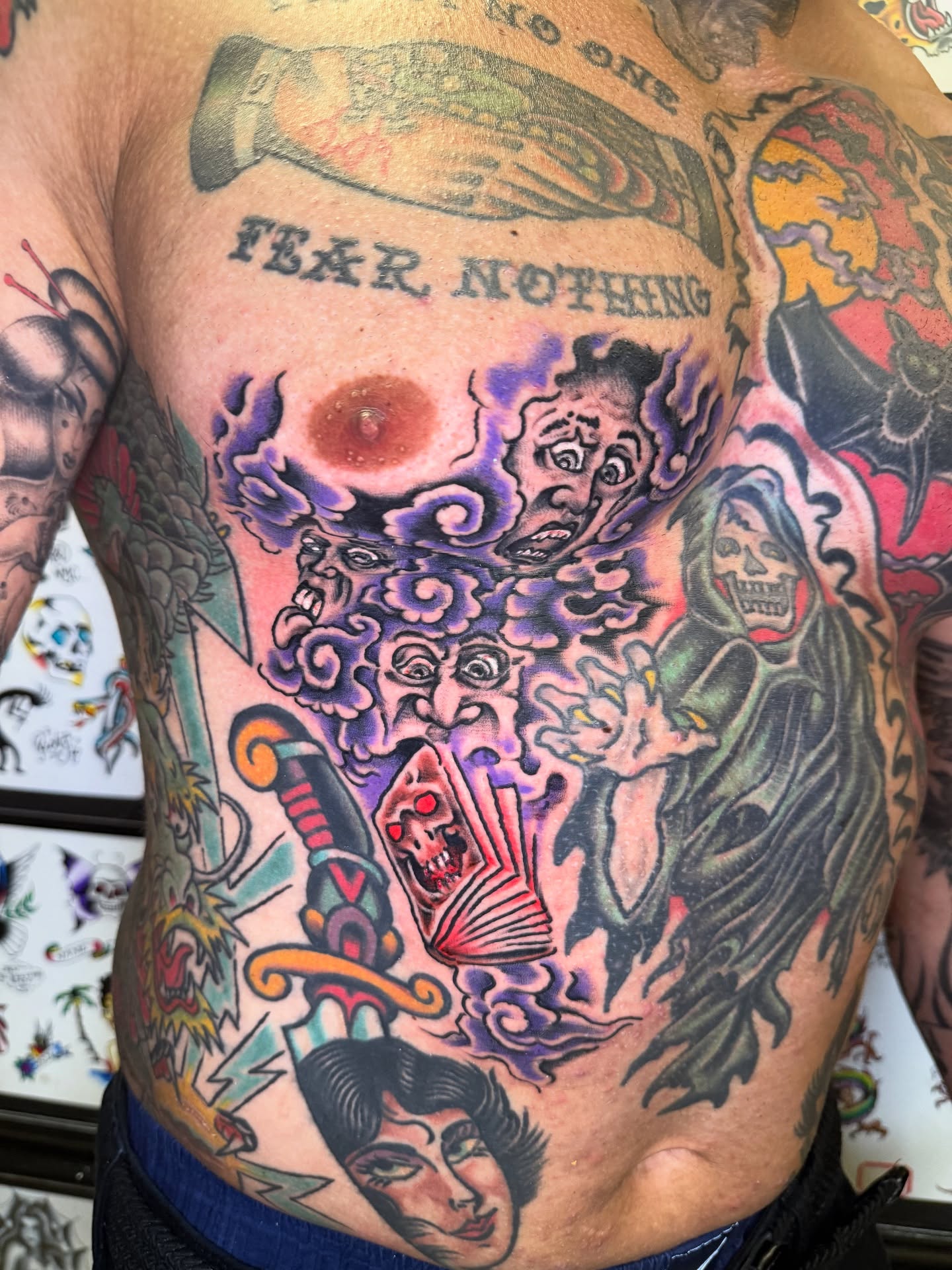 Surrealistic chest piece surrealism tattoo on the chest by Mike Dunn