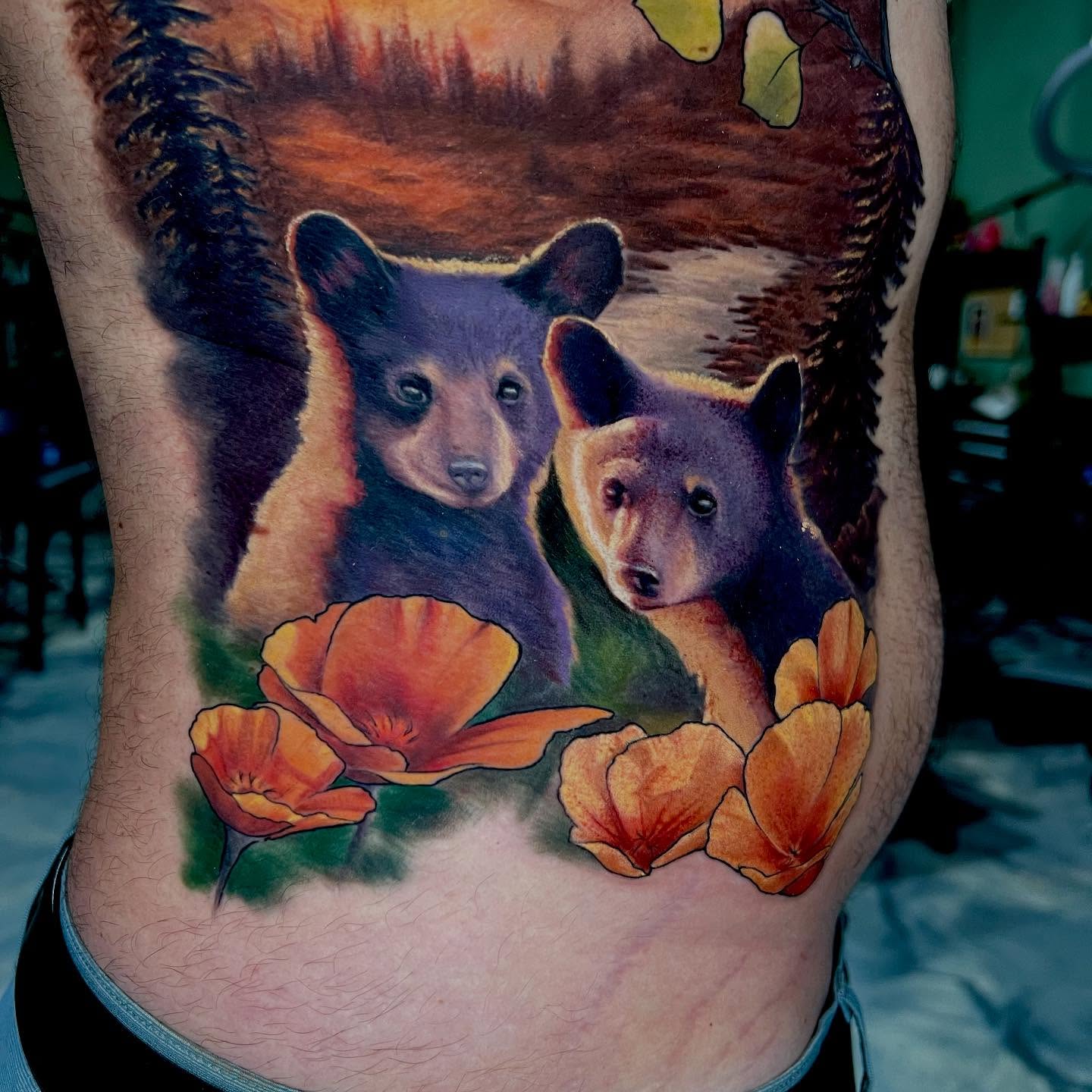 Bear cubs and poppies realism tattoo on the thigh by Mike j tattooer