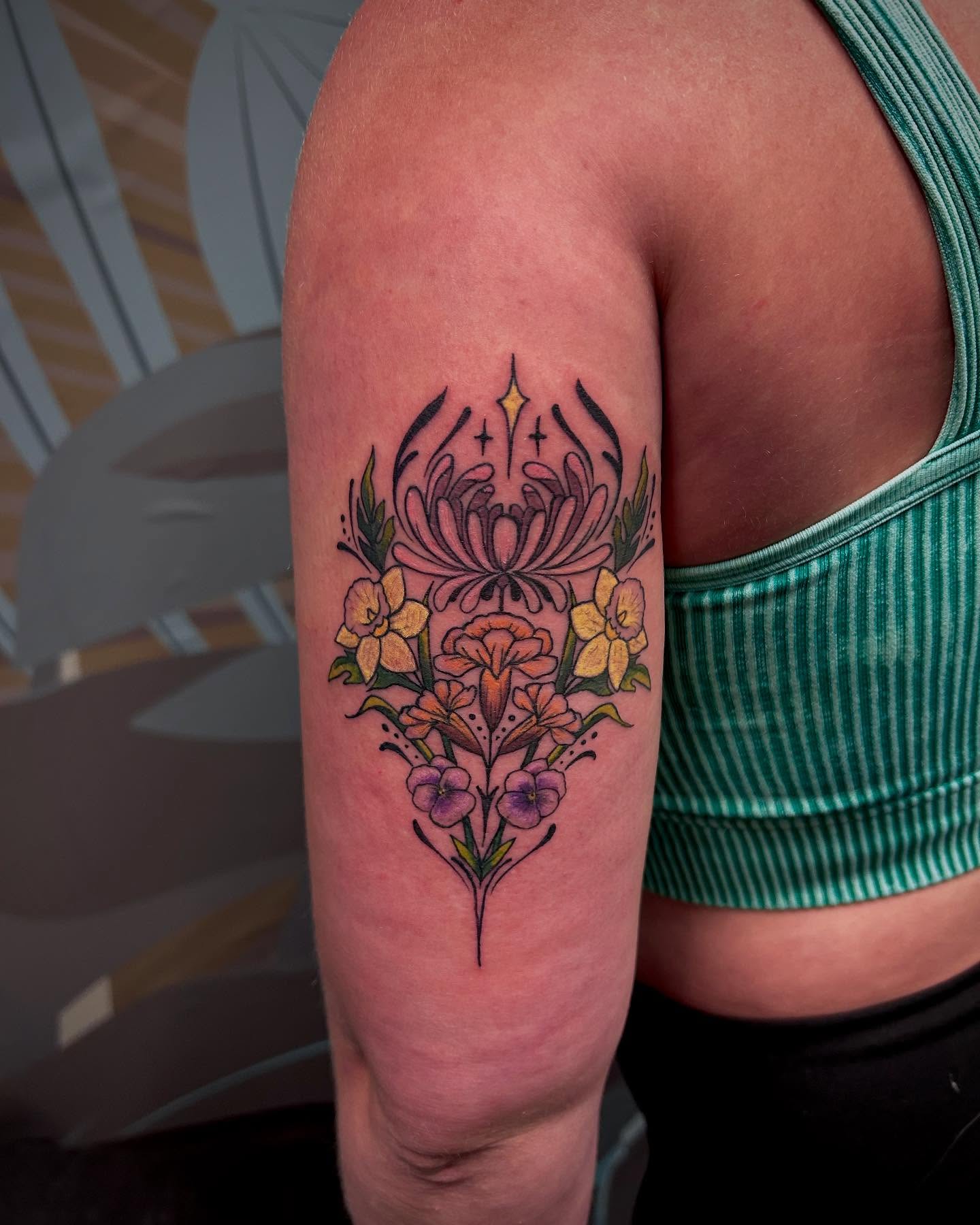 Floral arrangement new school tattoo on the forearm by Jon Byrd