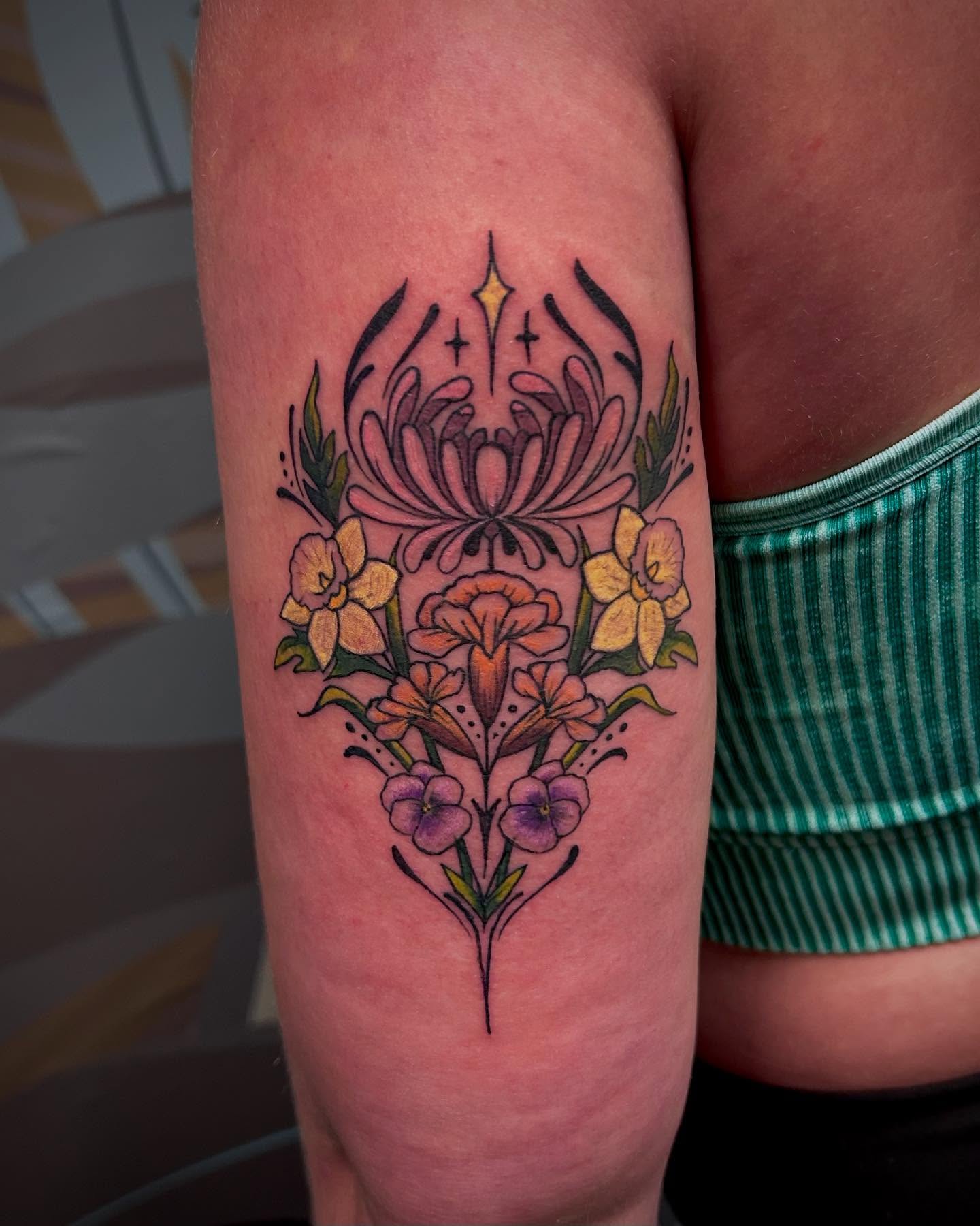 Floral arrangement new school tattoo on the thigh by Jon Byrd