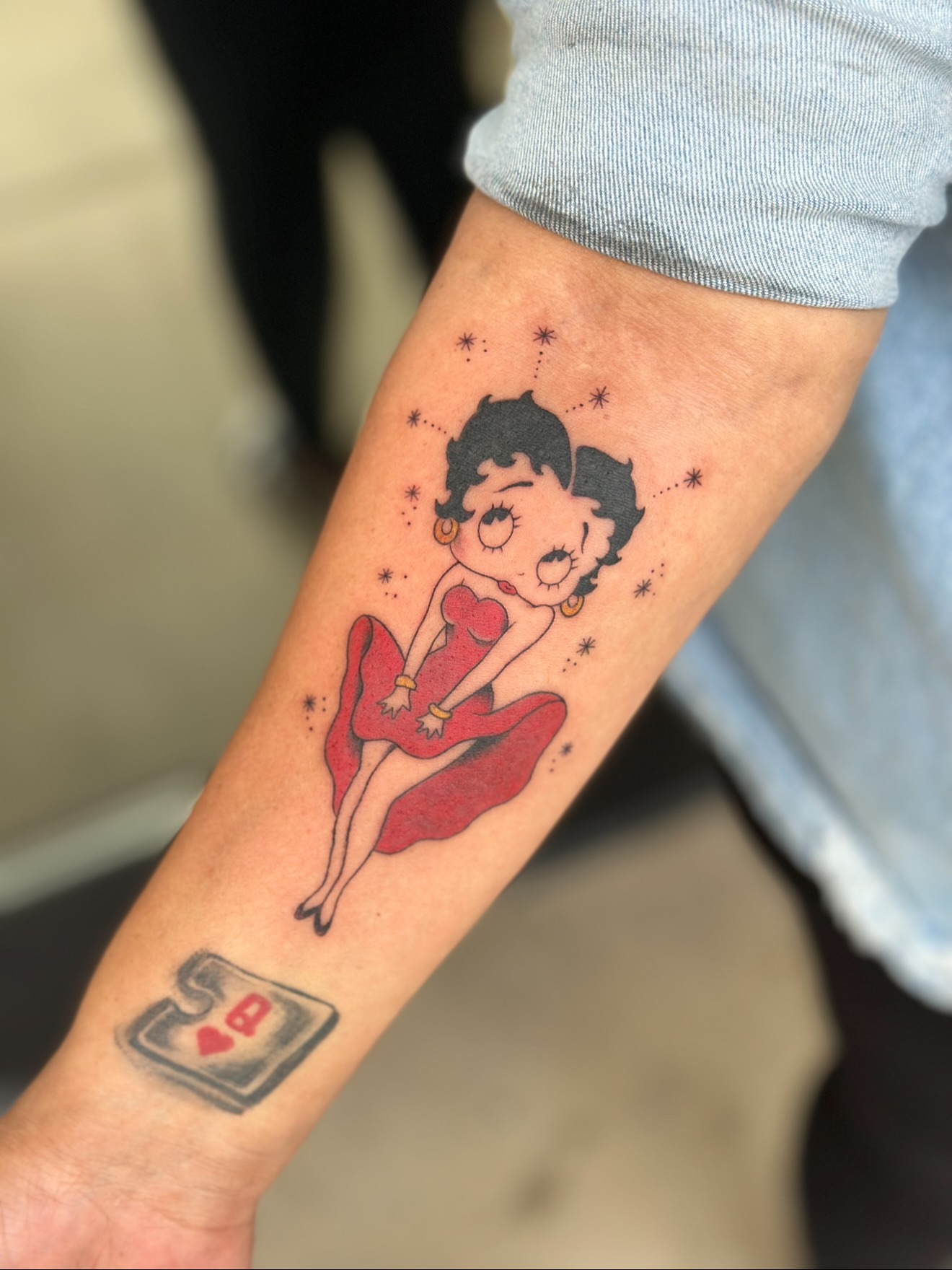 Betty Boop American traditional tattoo on the forearm by Jevon Glasco Tattoos