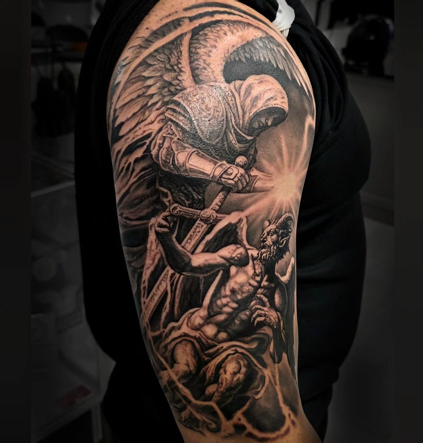 Angel and demon realism tattoo on the forearm by Julia Oravets