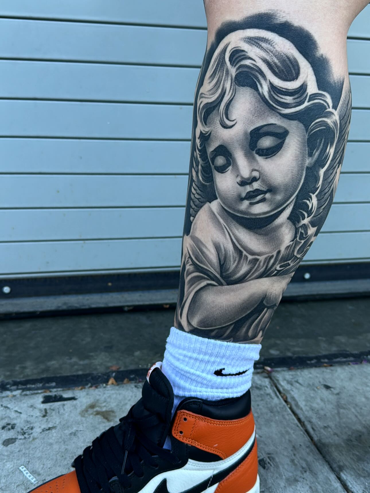 Tattoo by @eksoe_ — black_and_grey, realism