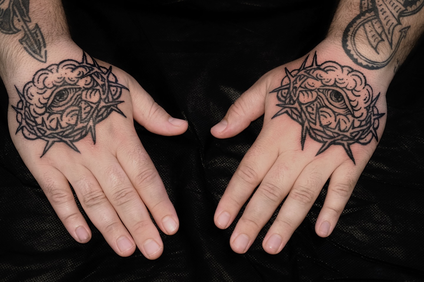 Eye within crown of thorns black and grey tattoo on the hand by ꜰʟᴏʀᴀ ᴡᴏᴏᴅᴄᴜᴛ ᴛᴀᴛᴛᴏᴏ