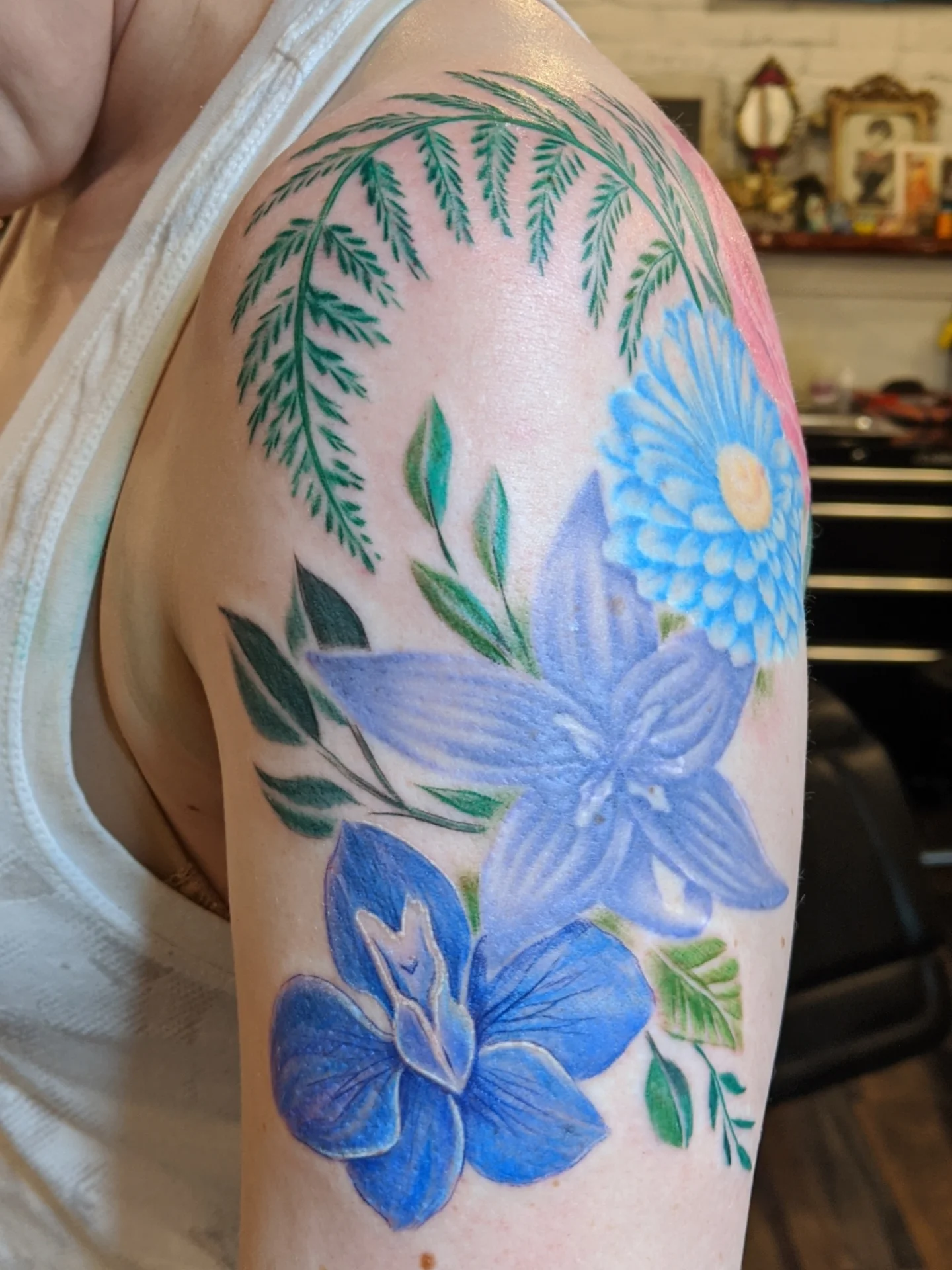 Floral arrangement new school tattoo on the shoulder by Ashton Allen-Ruiz, Portland, Oregon