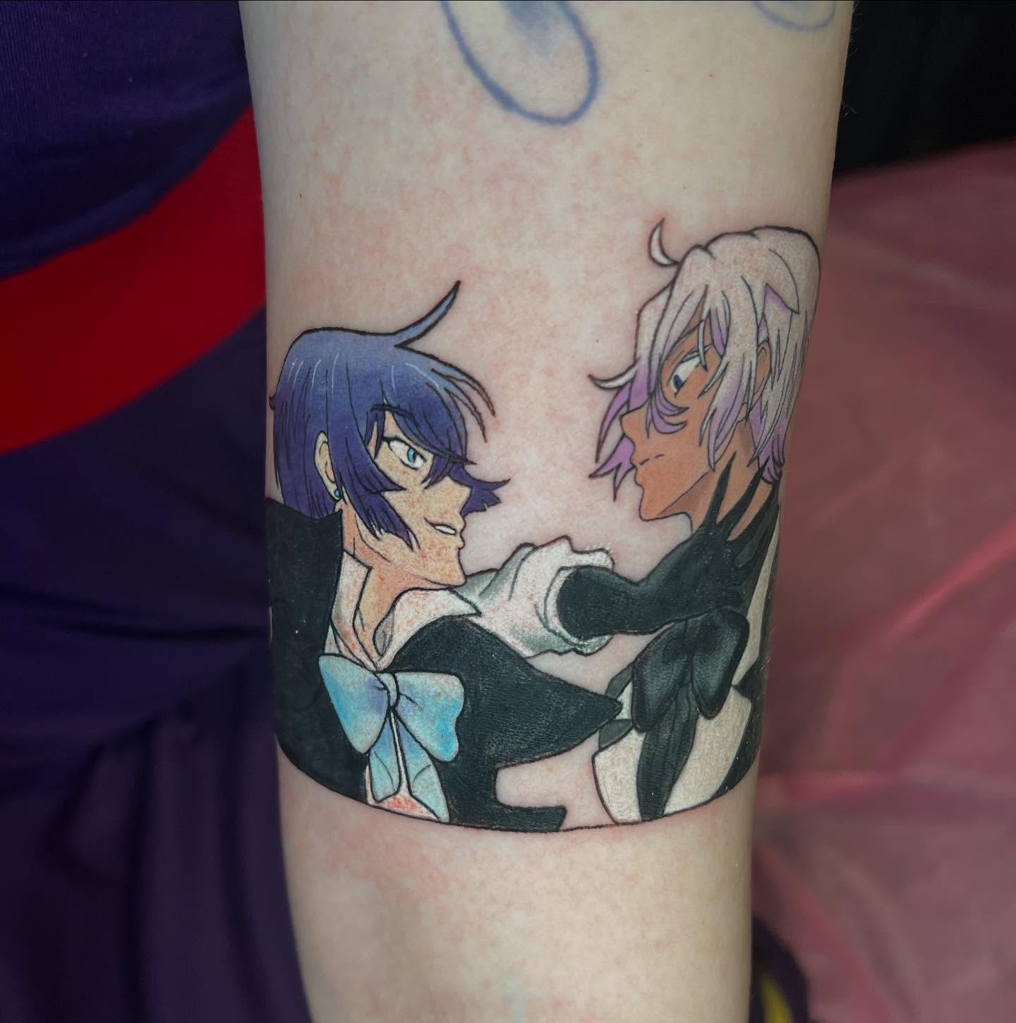 Anime characters anime tattoo on the forearm by Juliet Miller