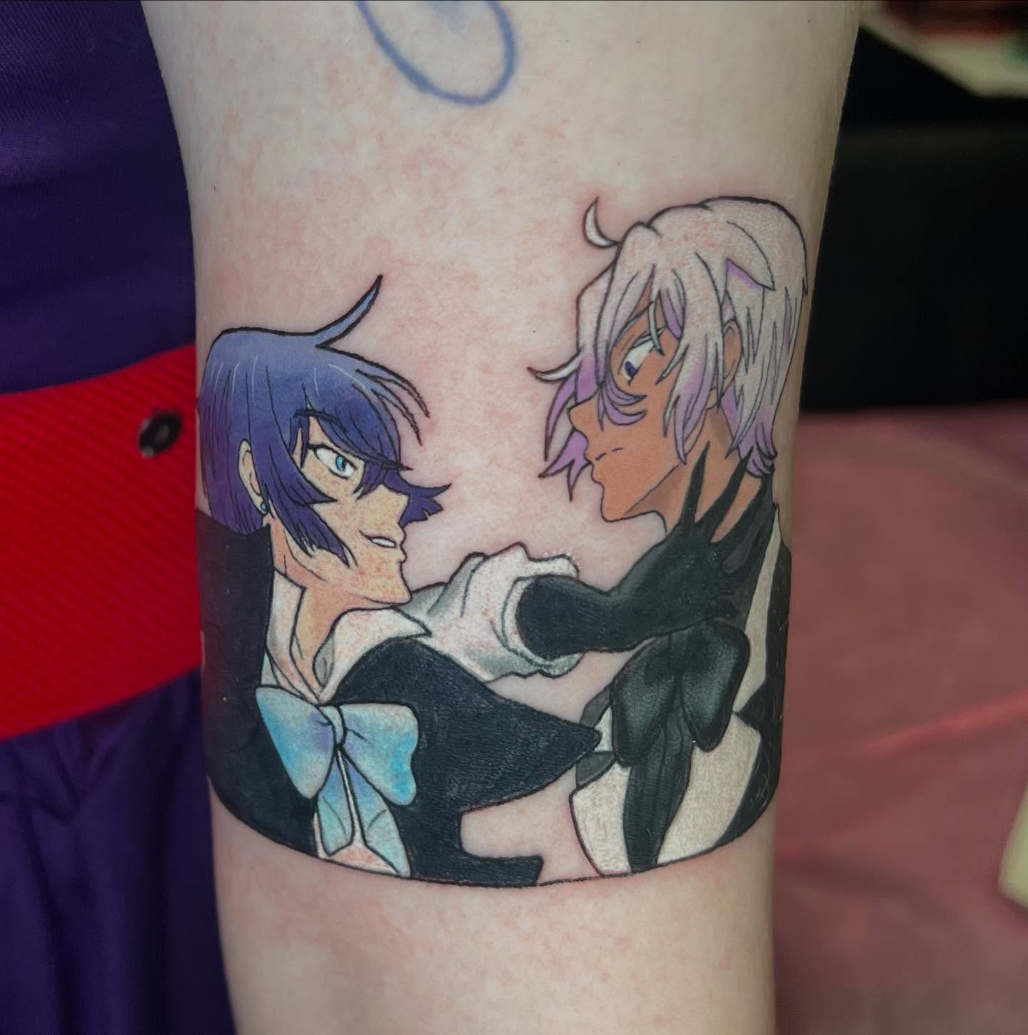 Anime characters anime tattoo on the forearm by Juliet Miller