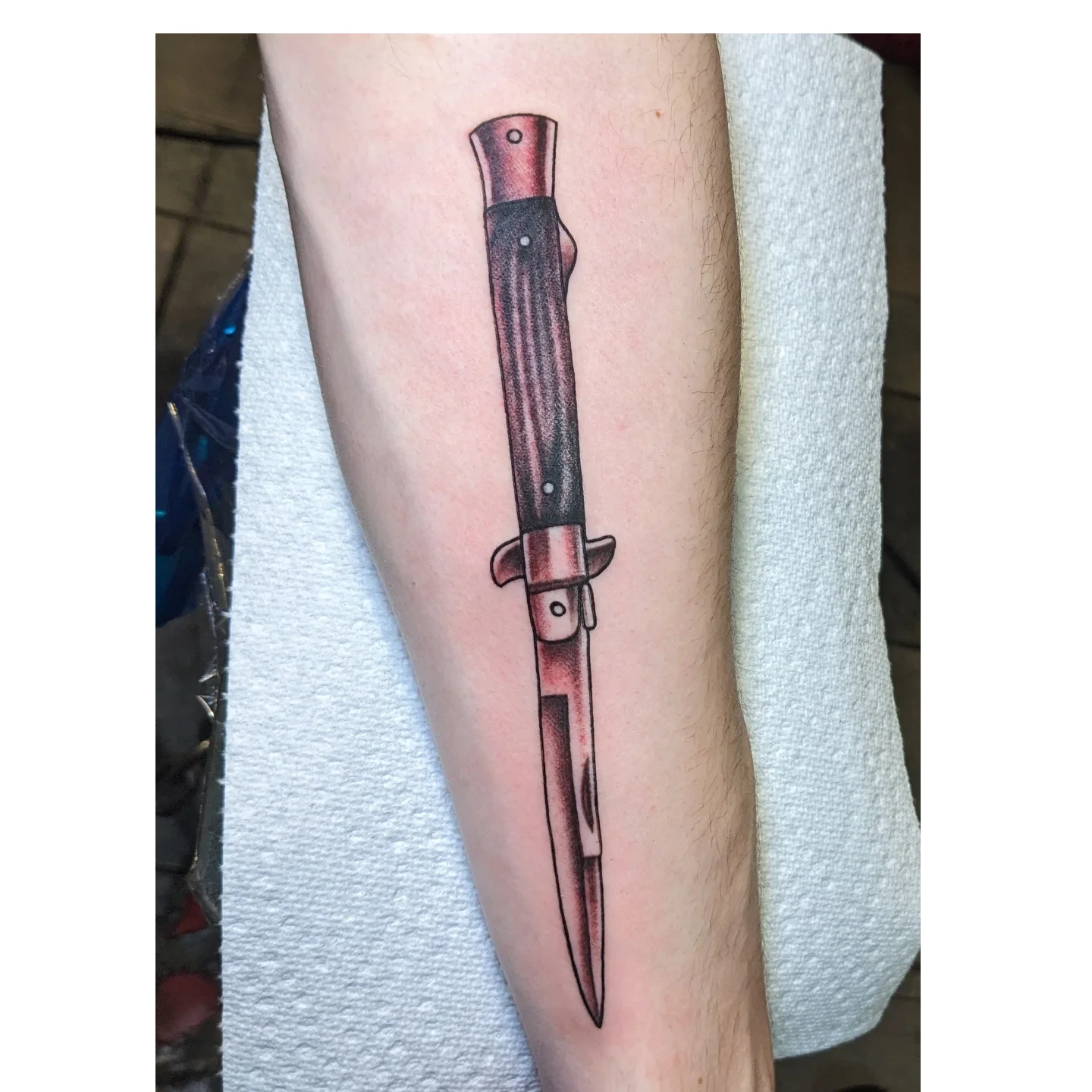 Knife realism tattoo on the forearm by Matt Simmonds