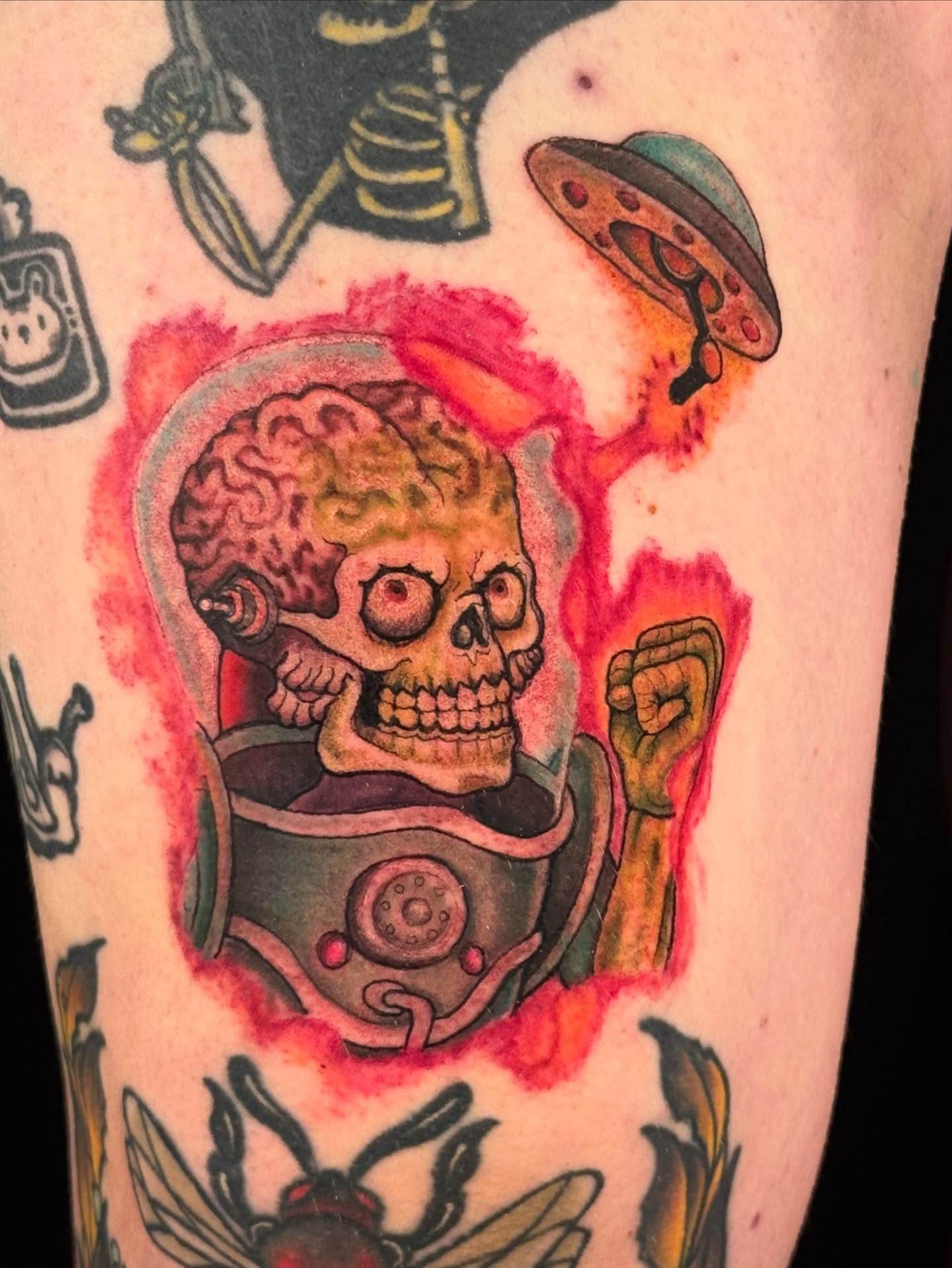 Skull in space suit American traditional tattoo on the forearm by Brandon Seven