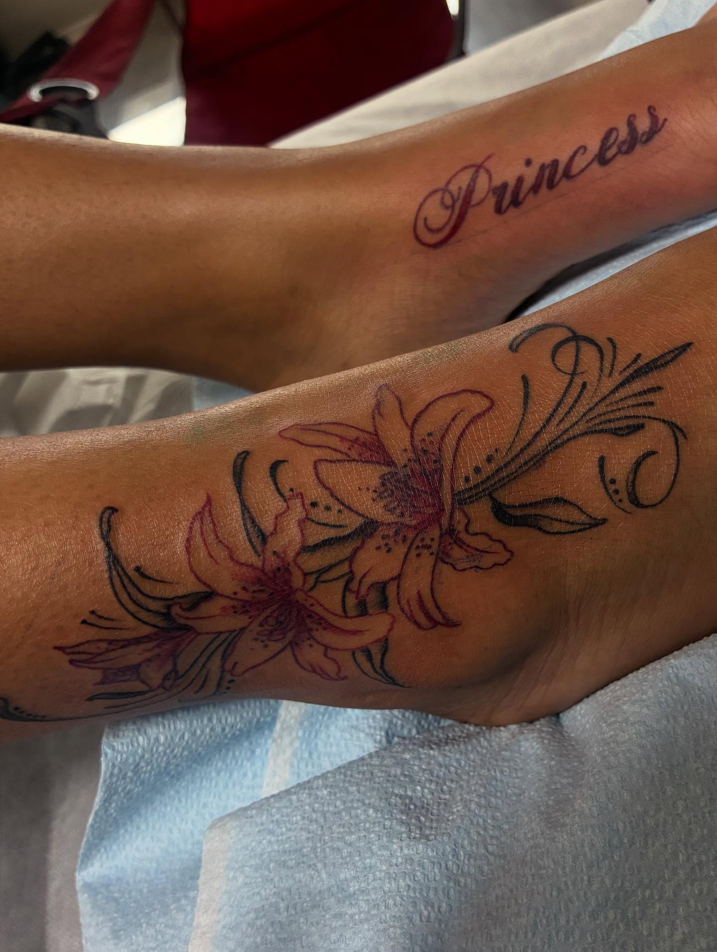 Lilies black and grey tattoo on the forearm by Nessa, Las Vegas, Nevada