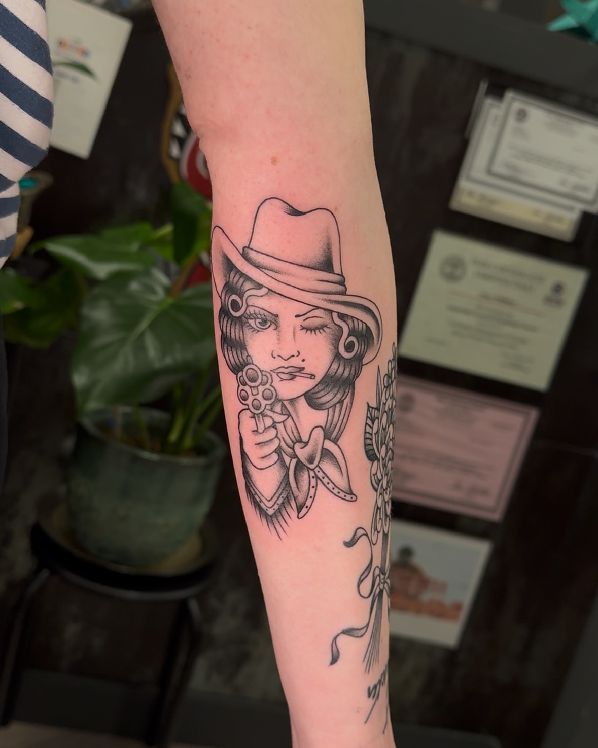 Flapper girl with gun American traditional tattoo on the forearm by πππͺ‘