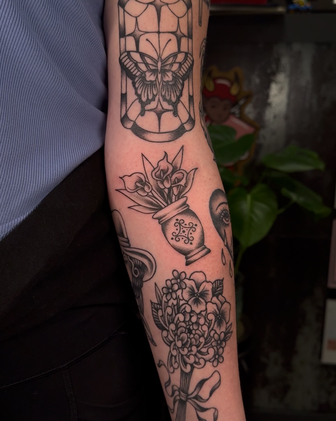 Flowers and jar black and grey tattoo on the forearm by πππͺ‘