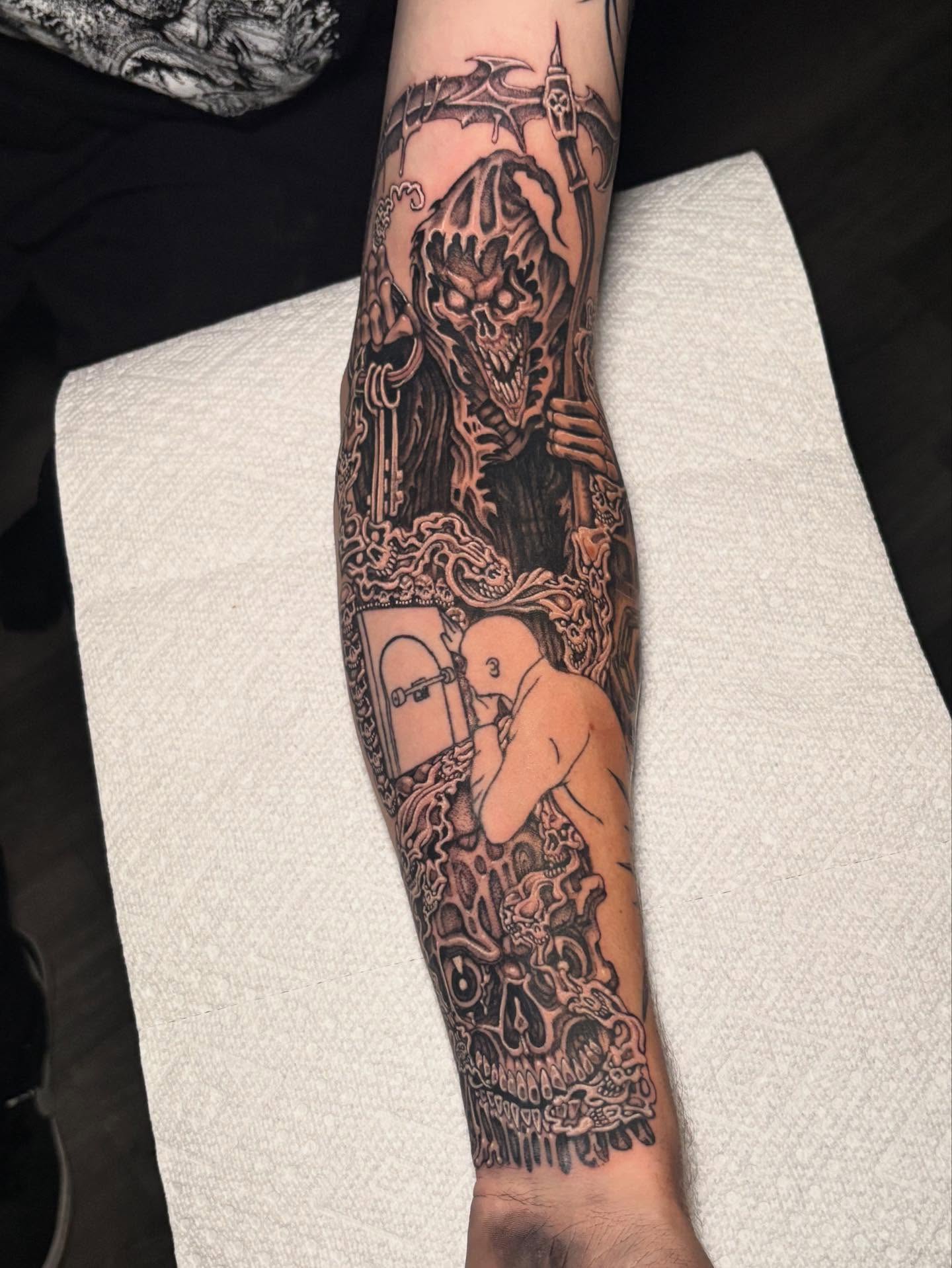 Demon and man dark realism tattoo on the forearm by Brendan Smith