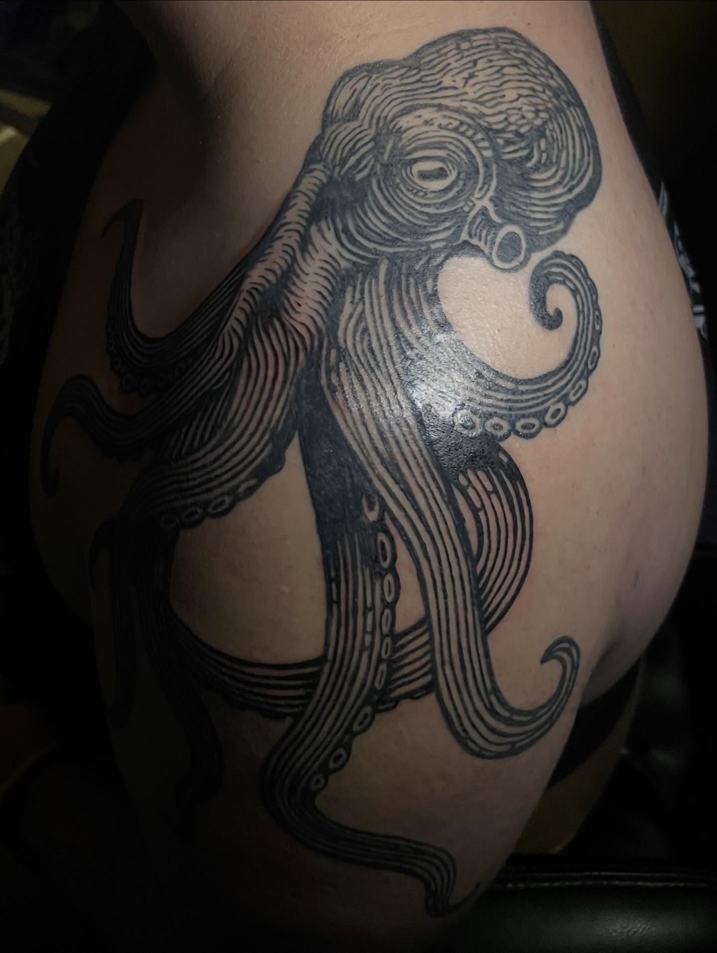 Octopus black and grey tattoo on the shoulder by Jason Middelton